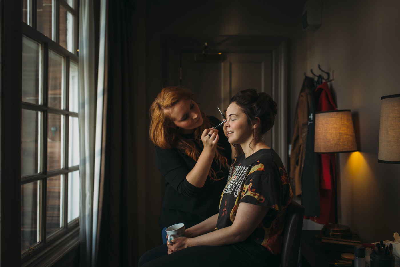 Bride having makeup done