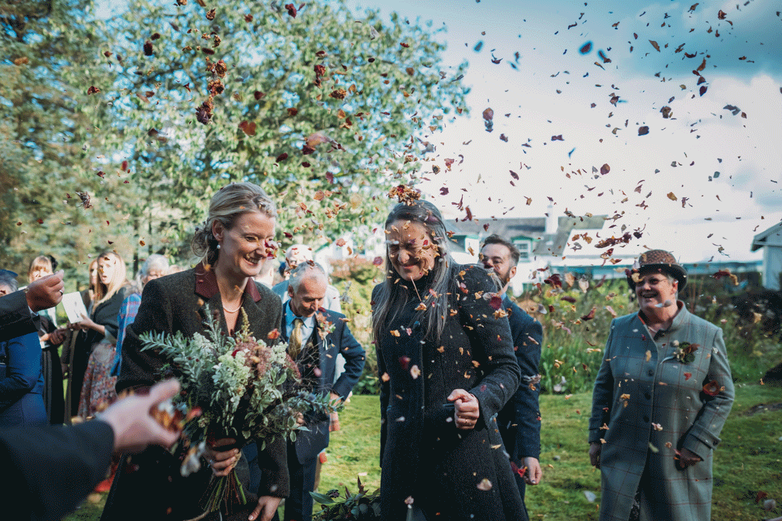 an epic confetti shot during jo and lori's reception timeline