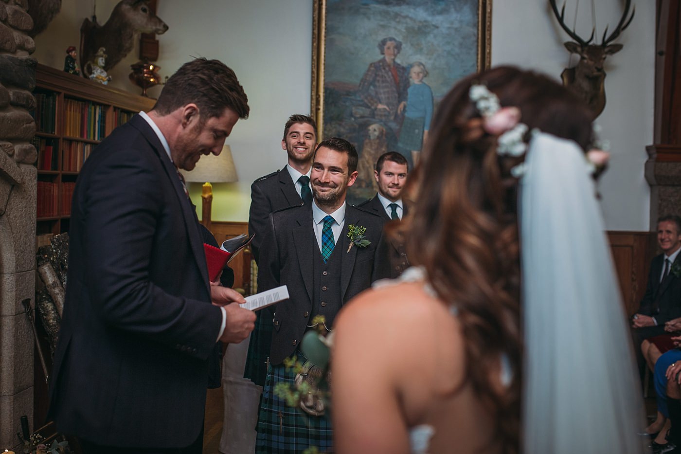 Groom during ceremony at his Christmas wedding at Glen Tanar