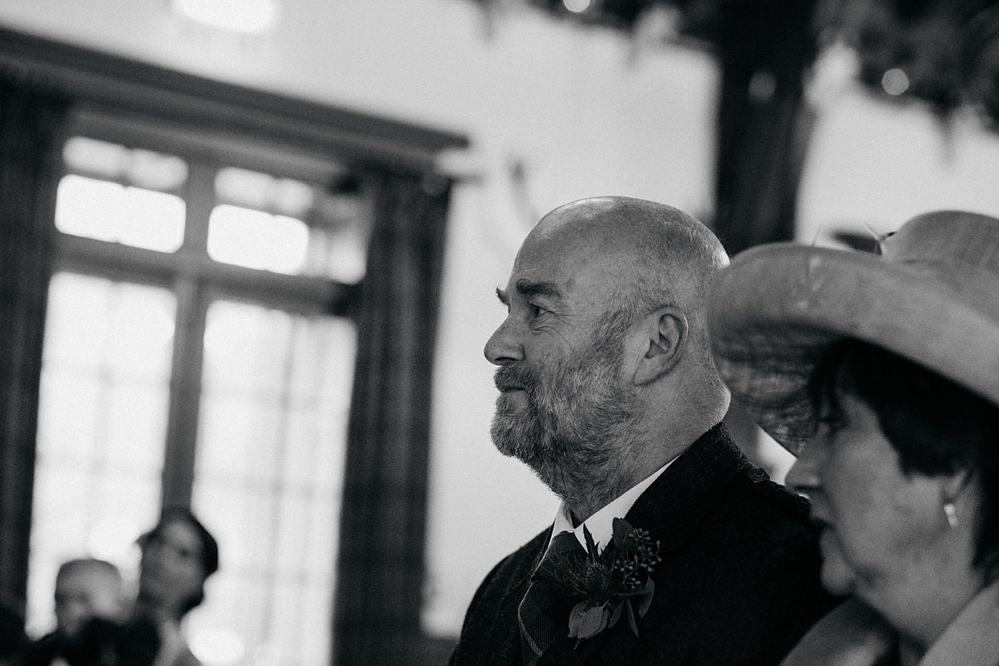 dad watches his daughter get married at her Christmas wedding at Glen Tanar