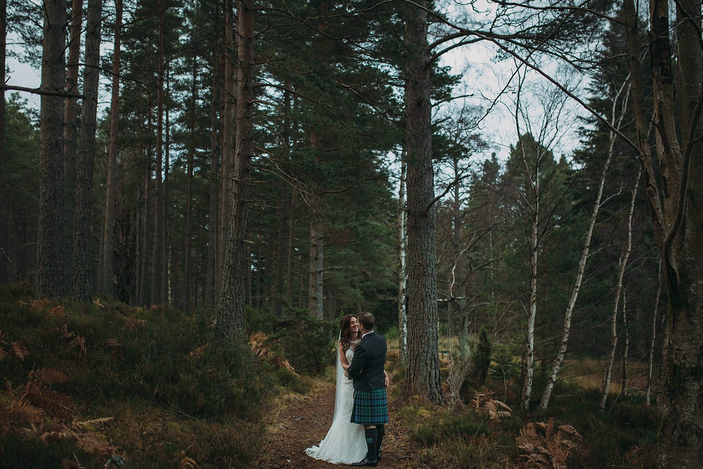 wide shot in woods at Christmas wedding at Glen Tanar