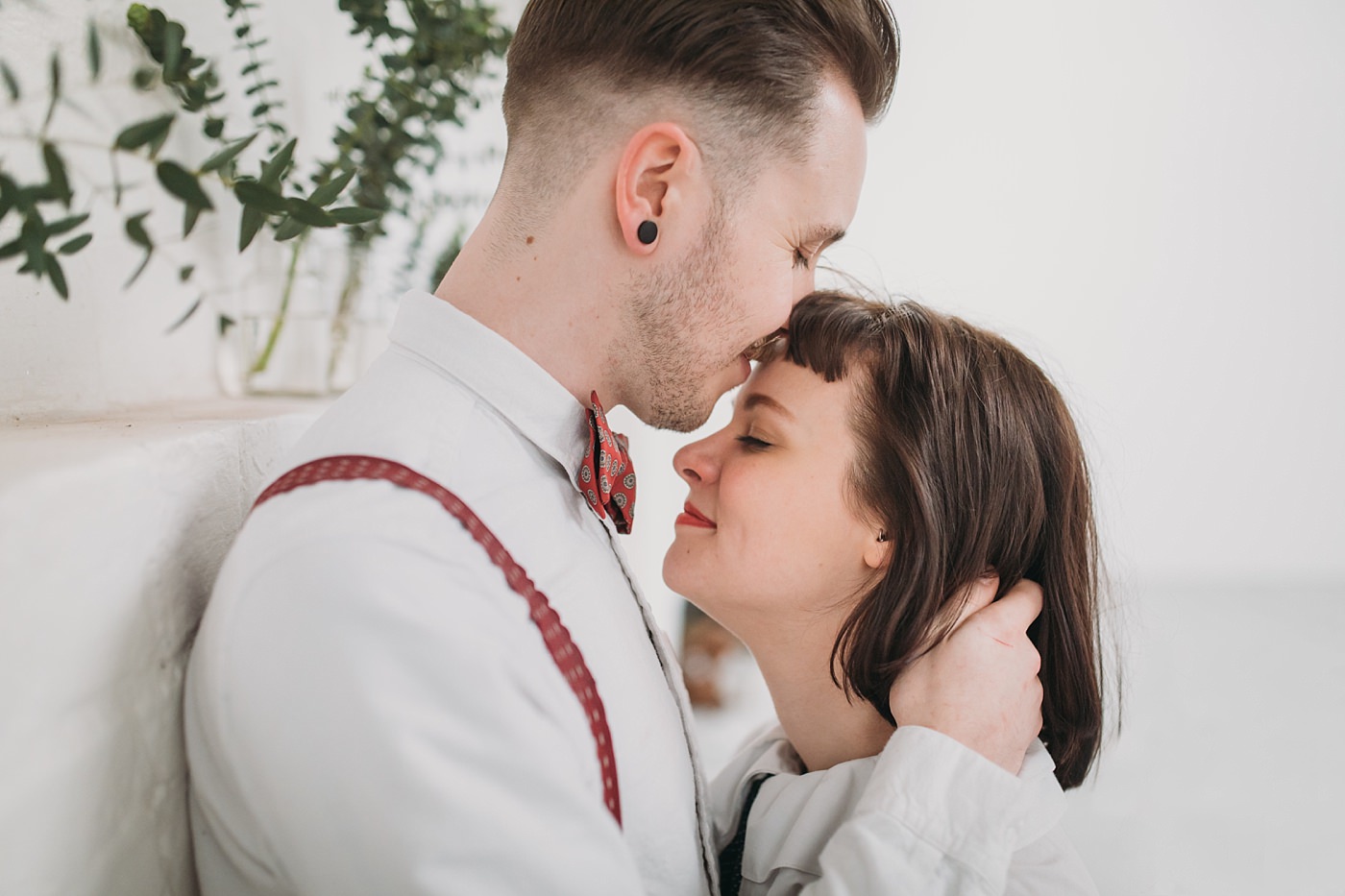 Joe & Steph of Bygone Photobooth Company embrace at the Glue Factory in Glasgow on their couples shoot