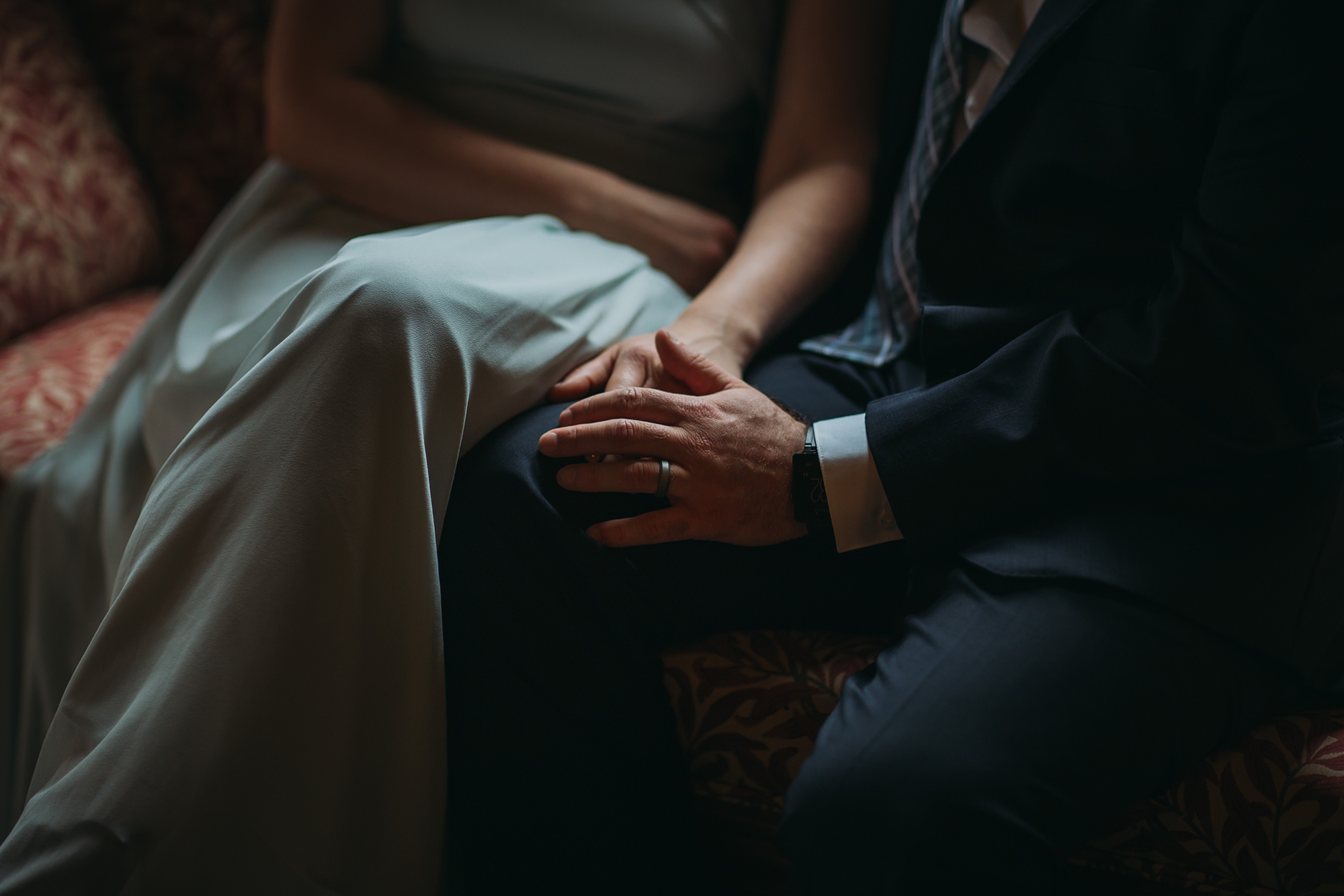 best wedding photographs - close up of newlyweds hands in window light