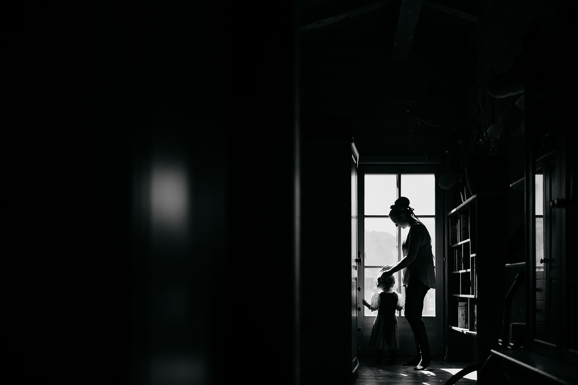 best wedding photographs of a bride silhouetted with her daughter