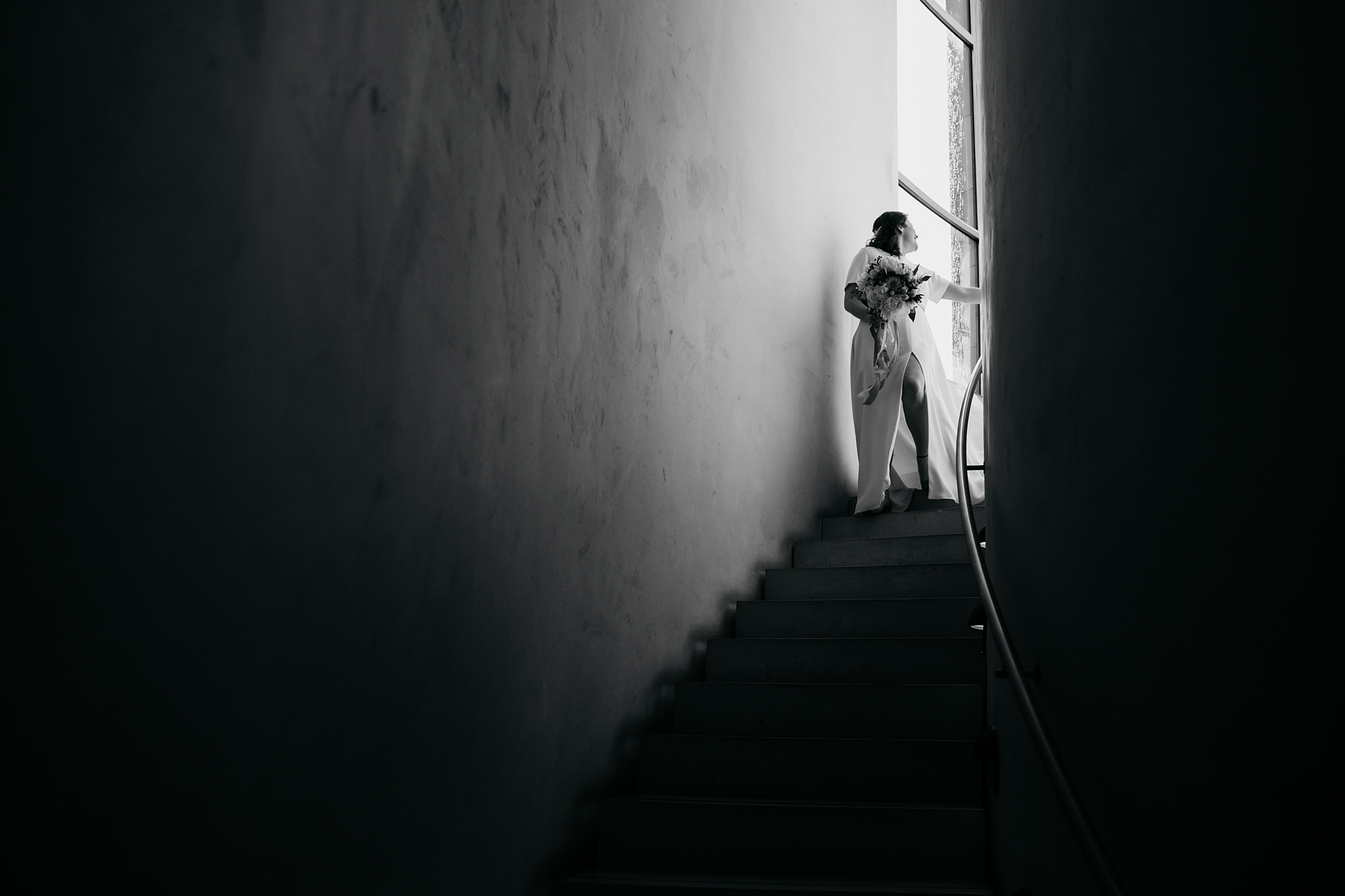 best wedding photographs of a bride on a stairway, heading to her Edinburgh elopement