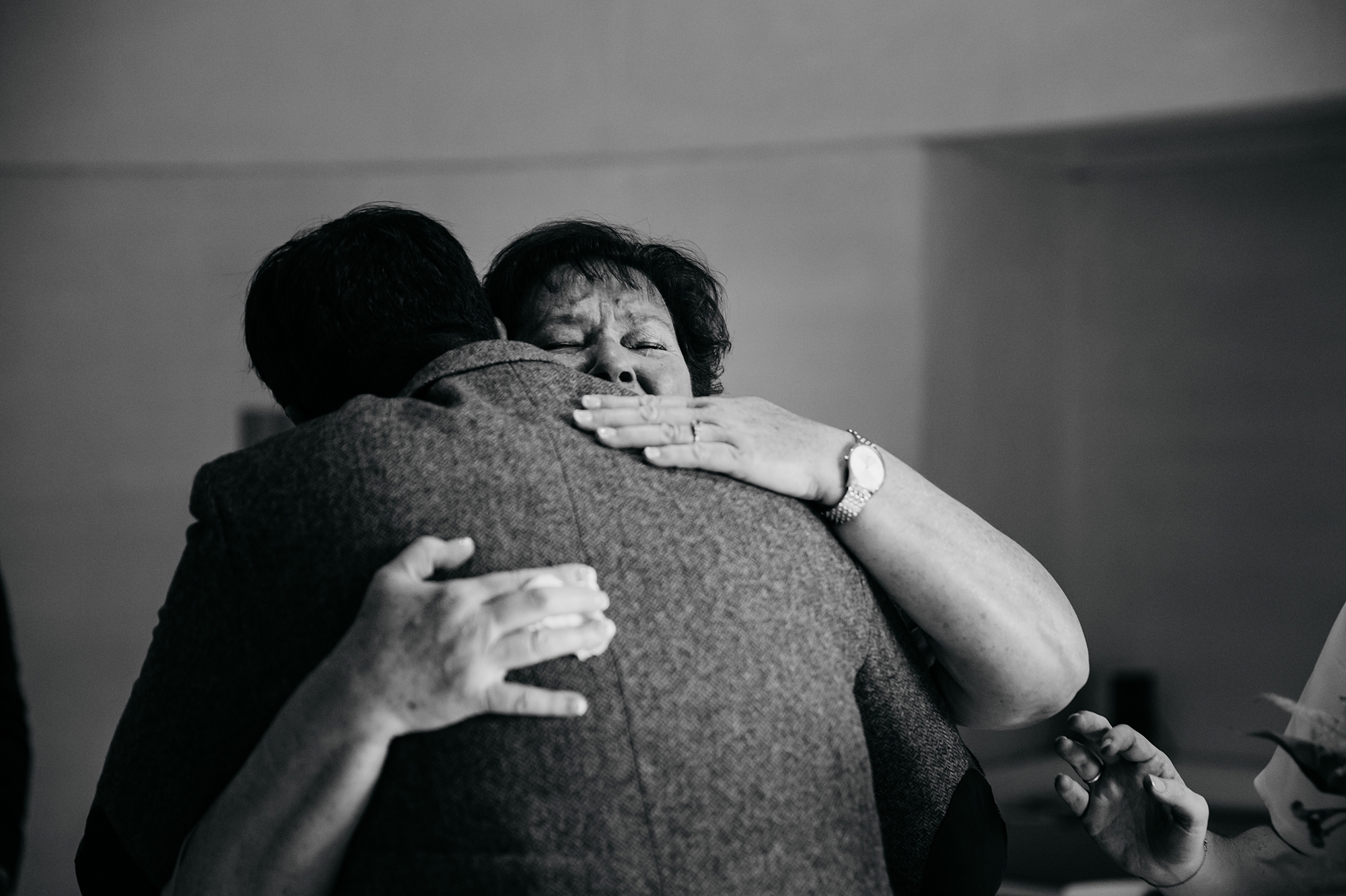 best wedding photographs of a mum hugging her new son in law in Edinburgh