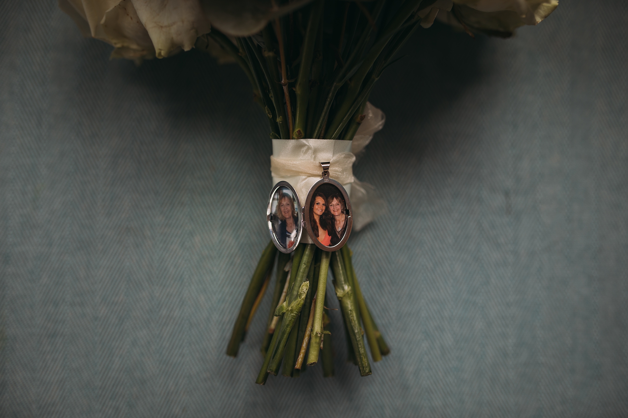best wedding photographs of a locket with the brides Mum on the bouquet