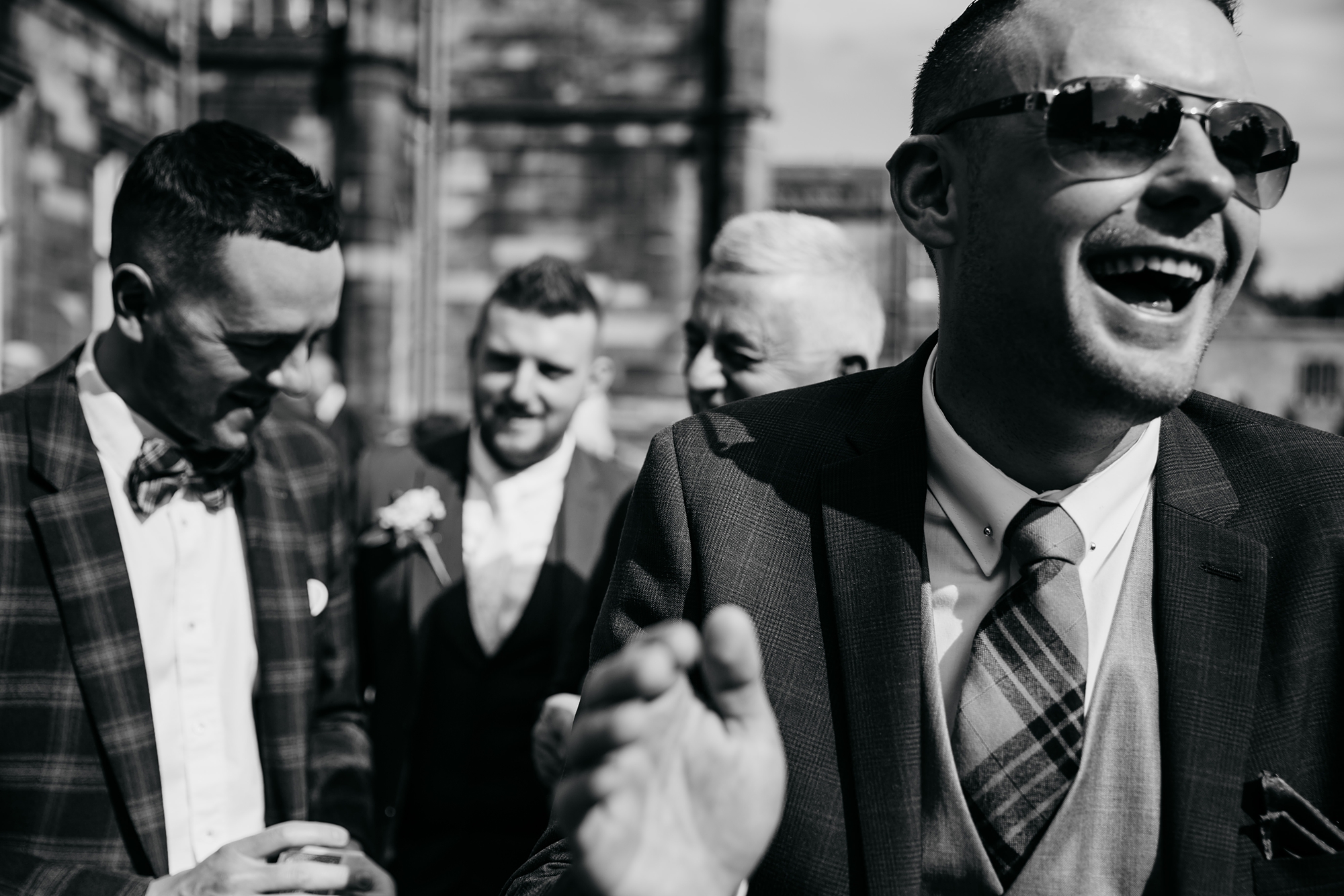 best wedding photographs of guests laughing at a reception