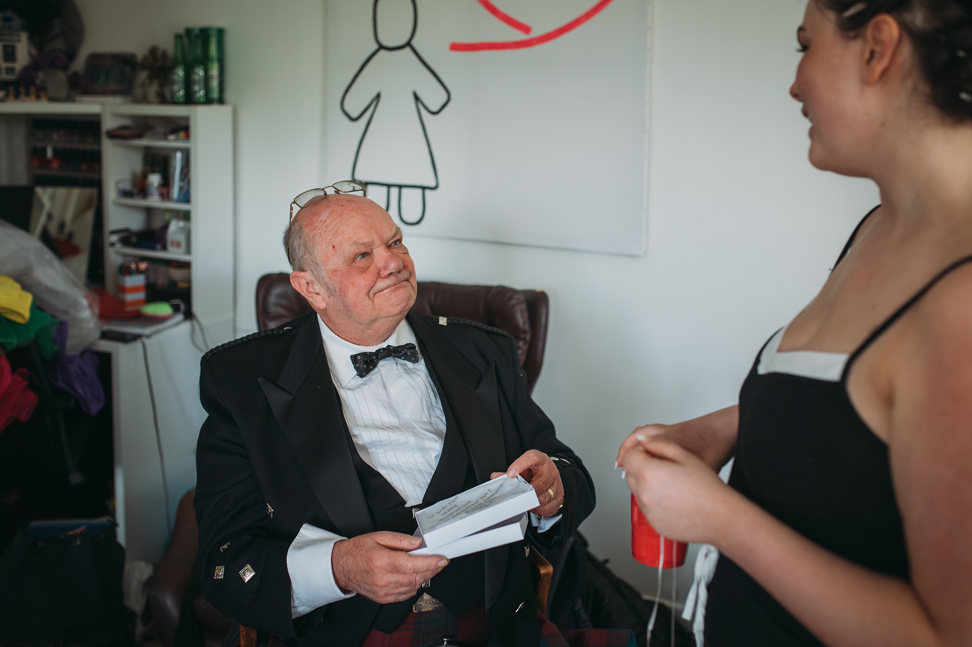best wedding photographs of a dad looking lovingly at his daughter