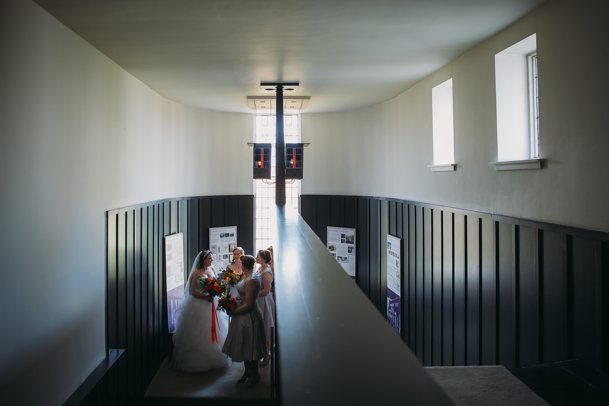 best wedding photographs of a bride waiting to walk in to her house for an art lover ceremony