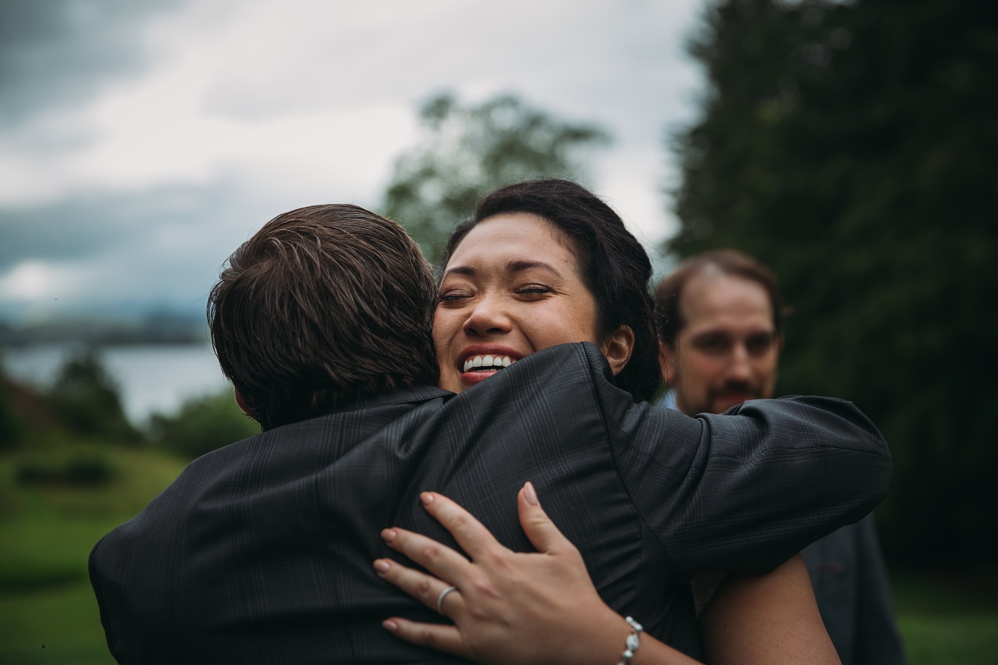 A bride gets a good hug after getting married in our 2017 best wedding photographs blog
