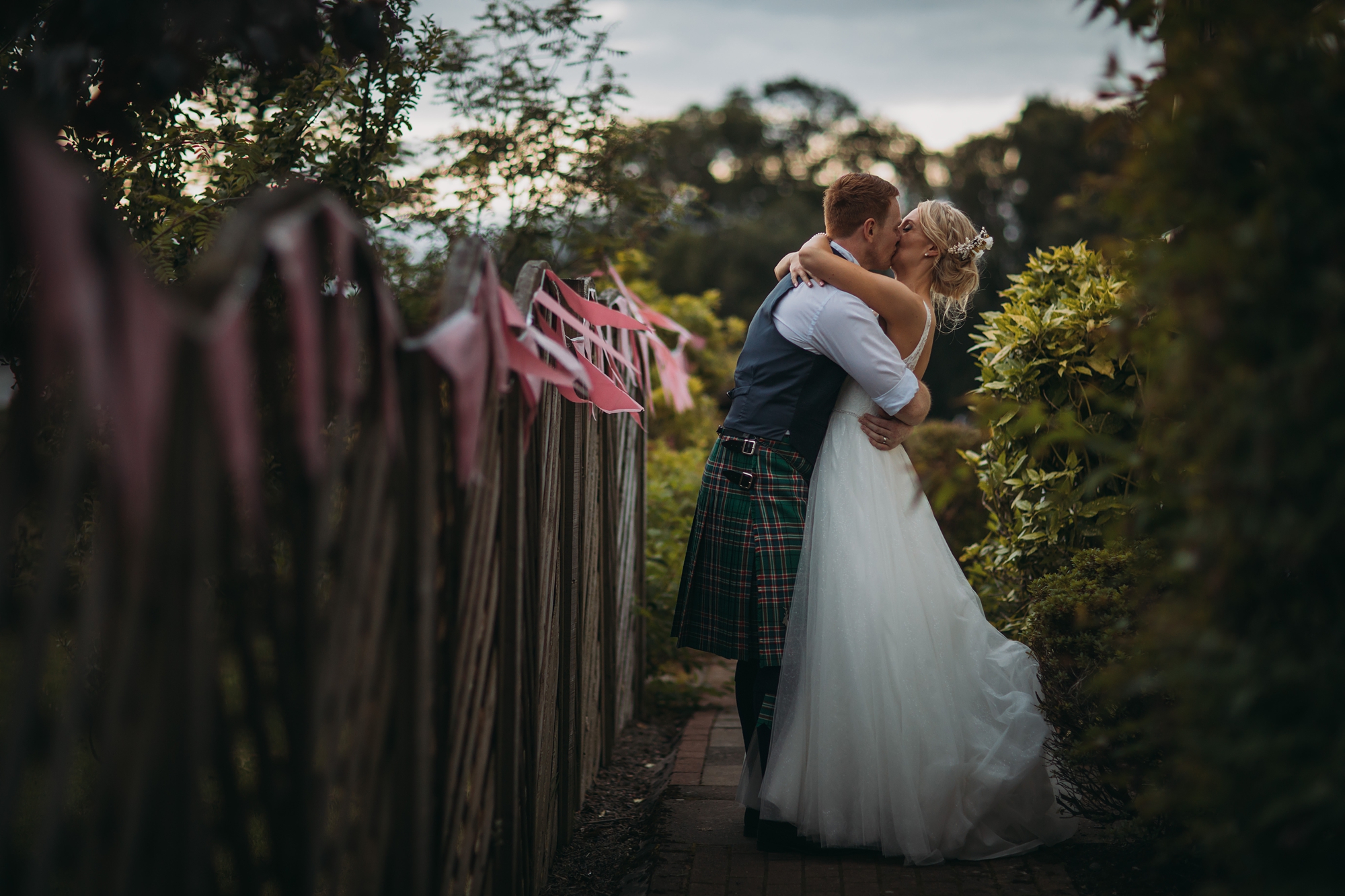 newlyweds in the evening ight at Loch Lomond, best wedding photographs