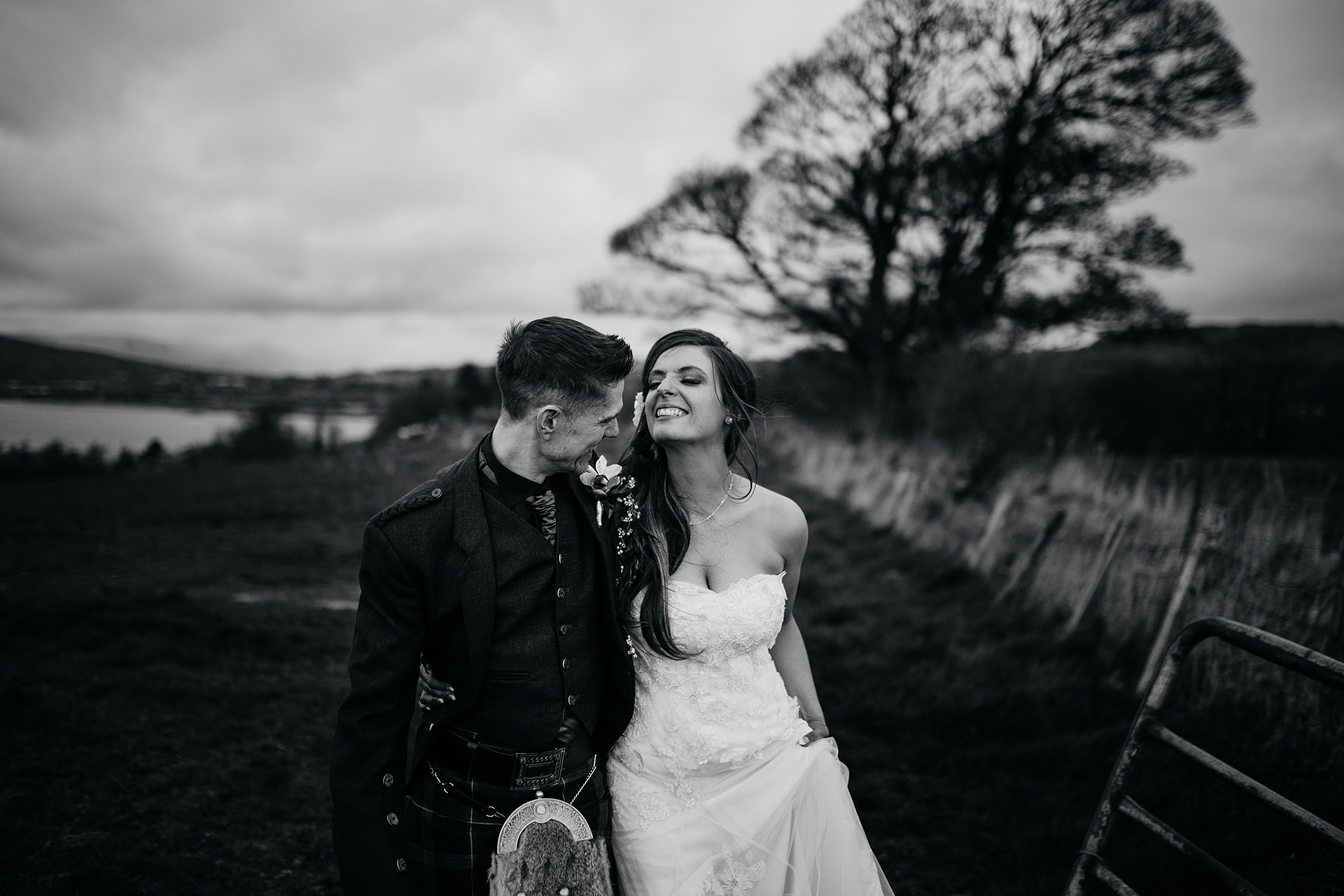 best wedding photographs in renfrewshire, newlyweds walka and laugh