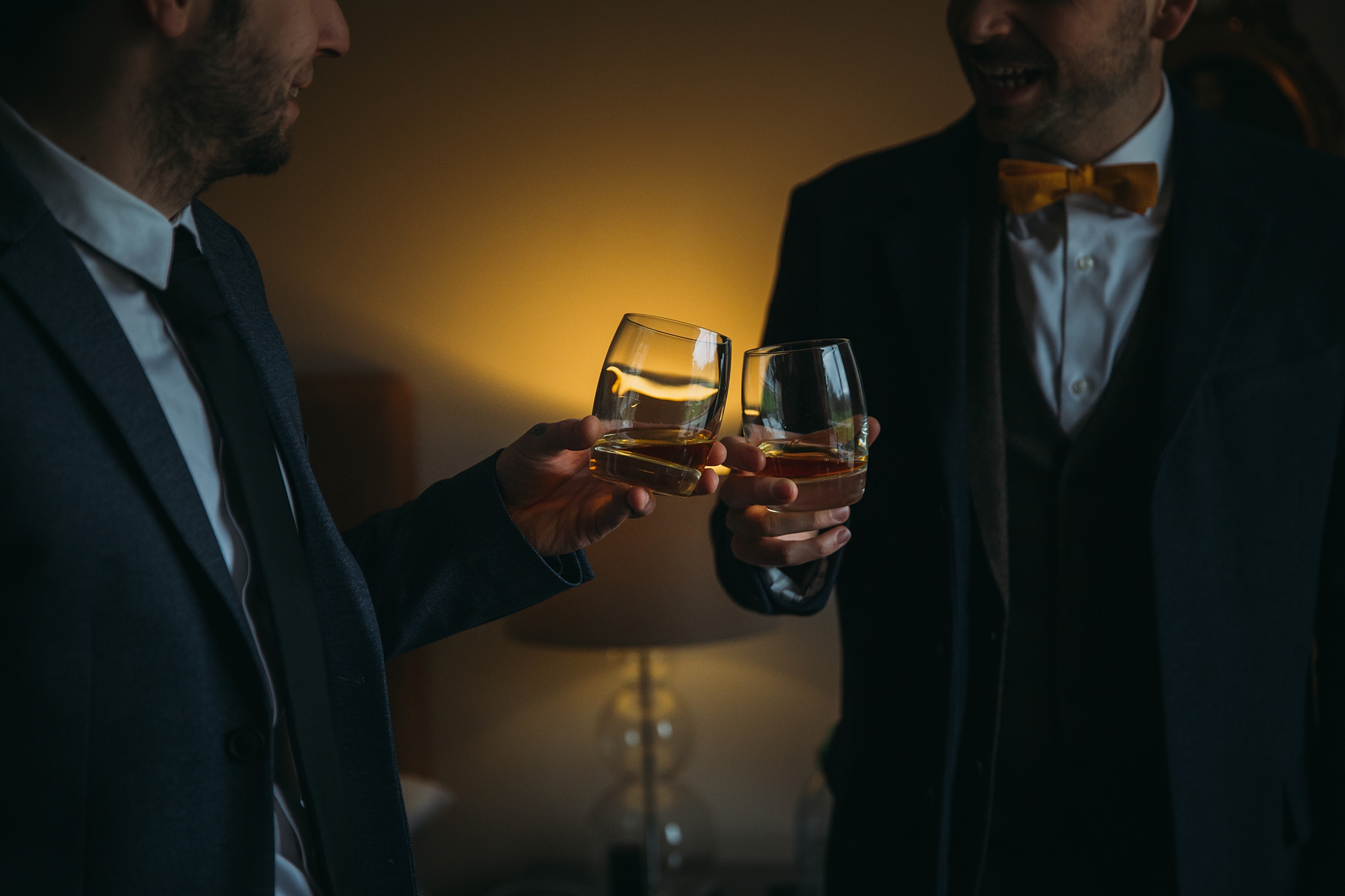 best wedding photographs in ardeonaig - men cheers their whisky