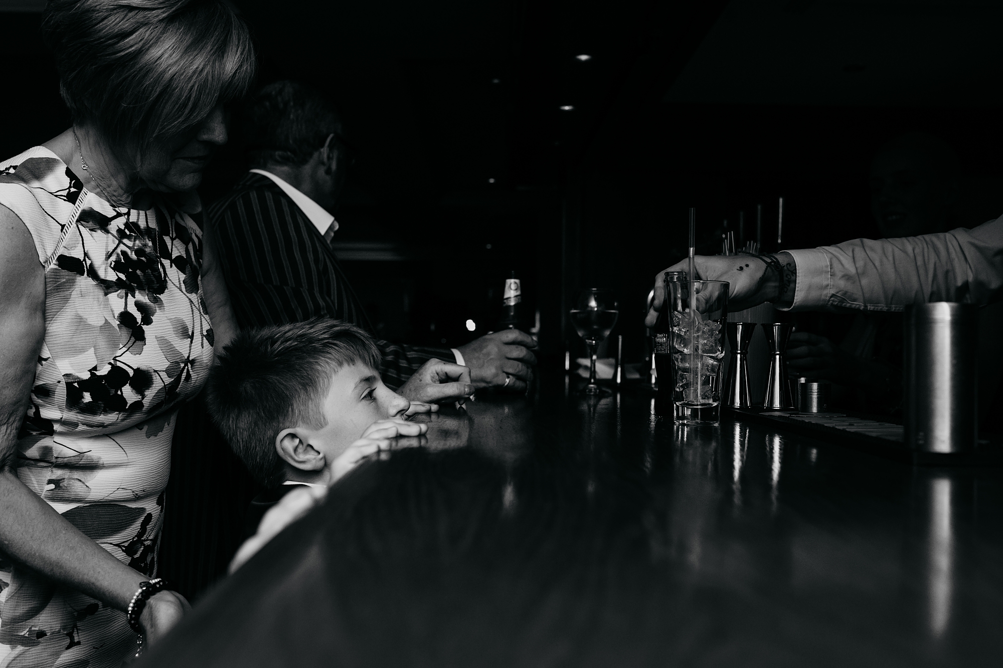 best wedding photographs small child peeks over bar
