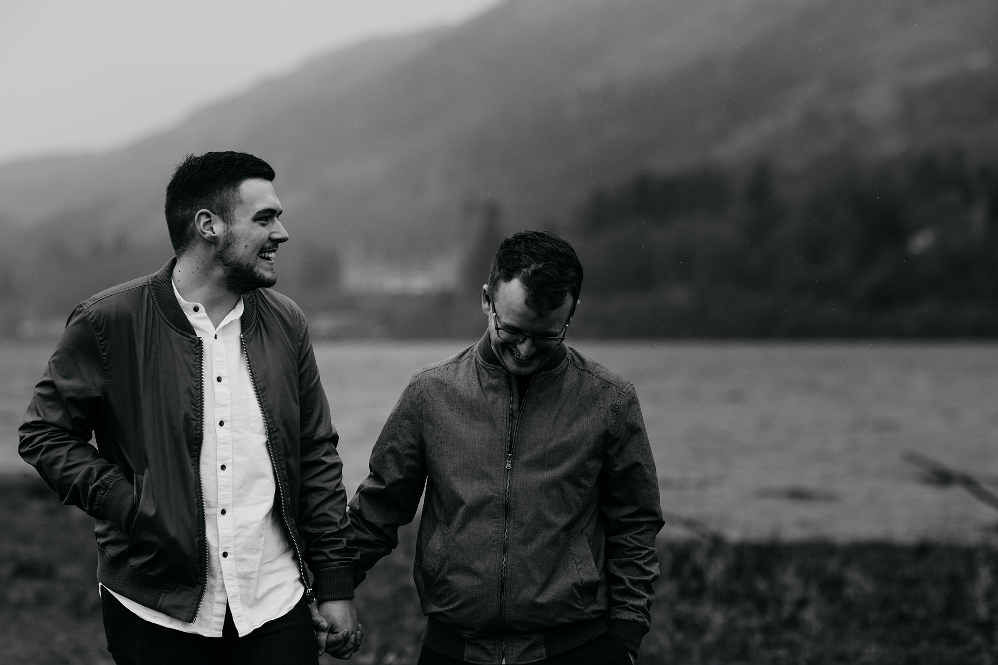 best wedding photographs, Martyn and Thomas hold hands and walk in the rain