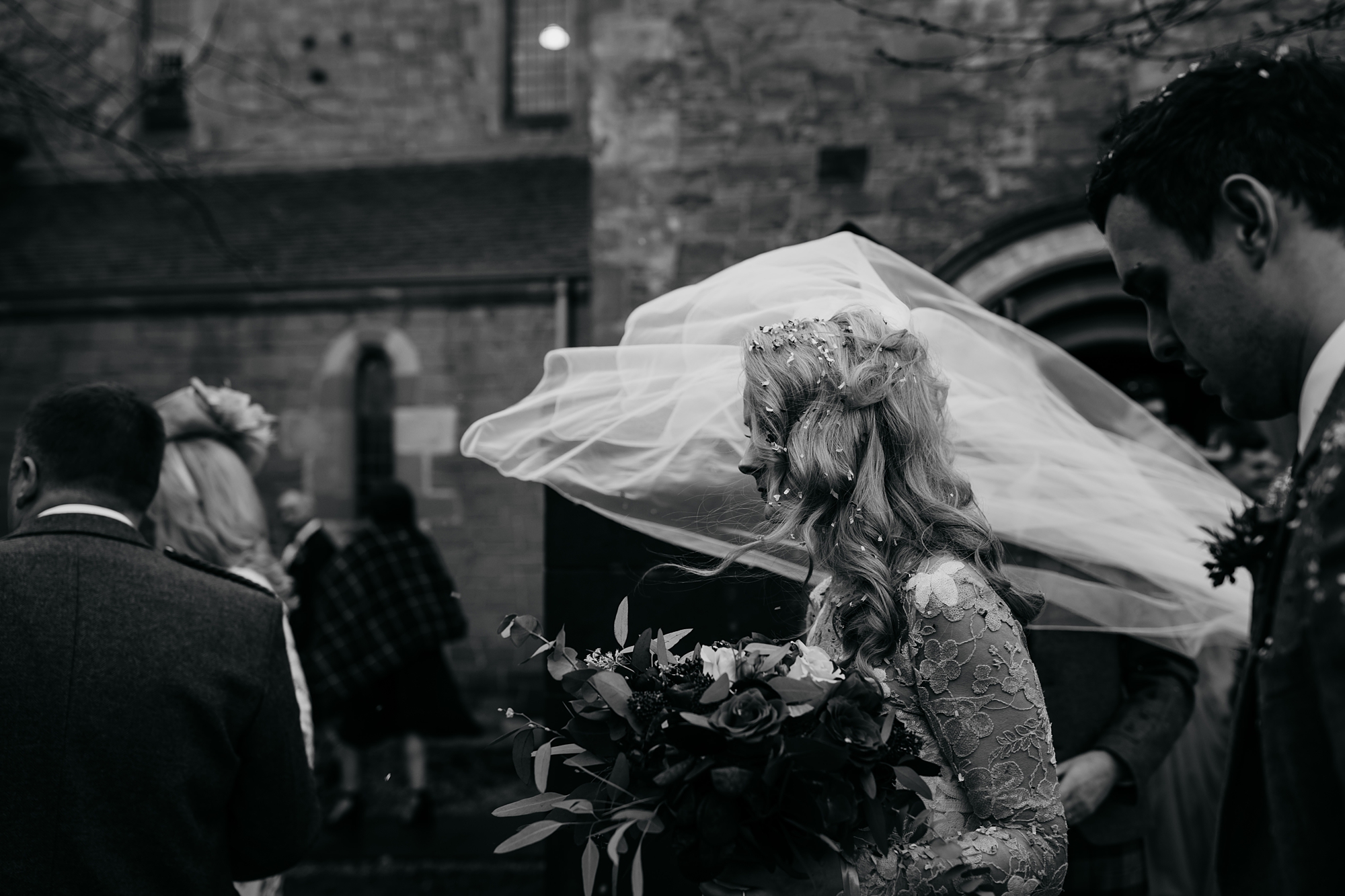 best wedding photographs - brides veil blows in wind