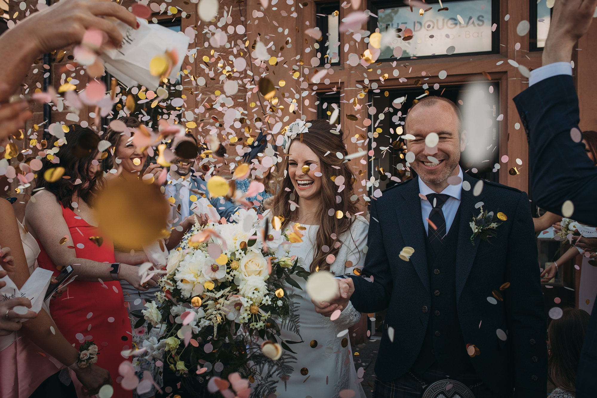 a confetti run on a wedding day in arran, best wedding photographs