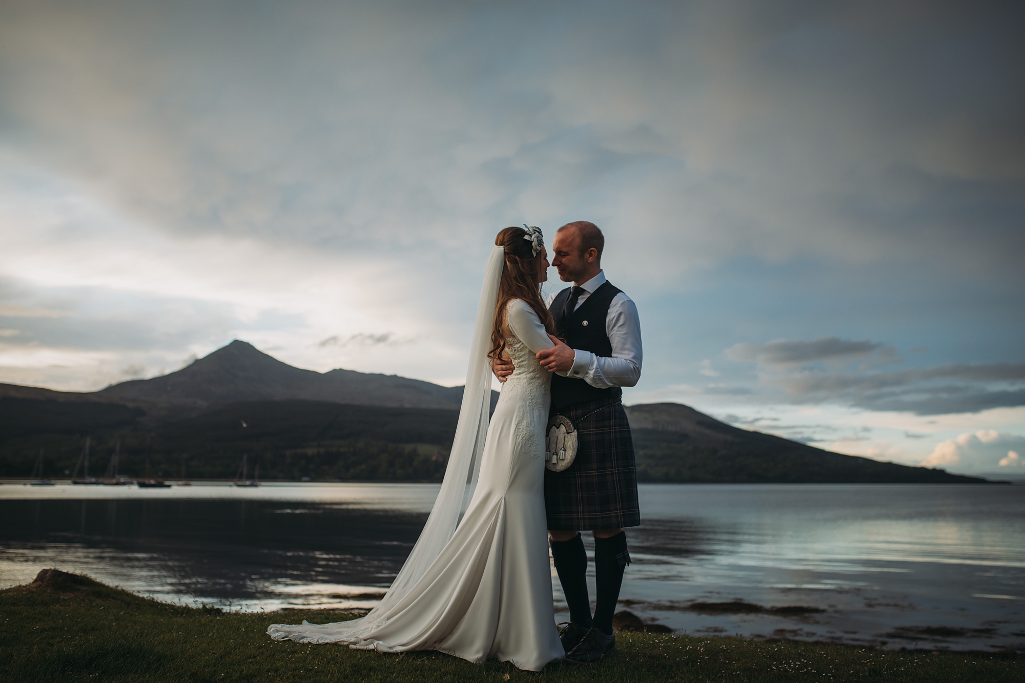 a couple embrace on their arran wedding day - best wedding photographs