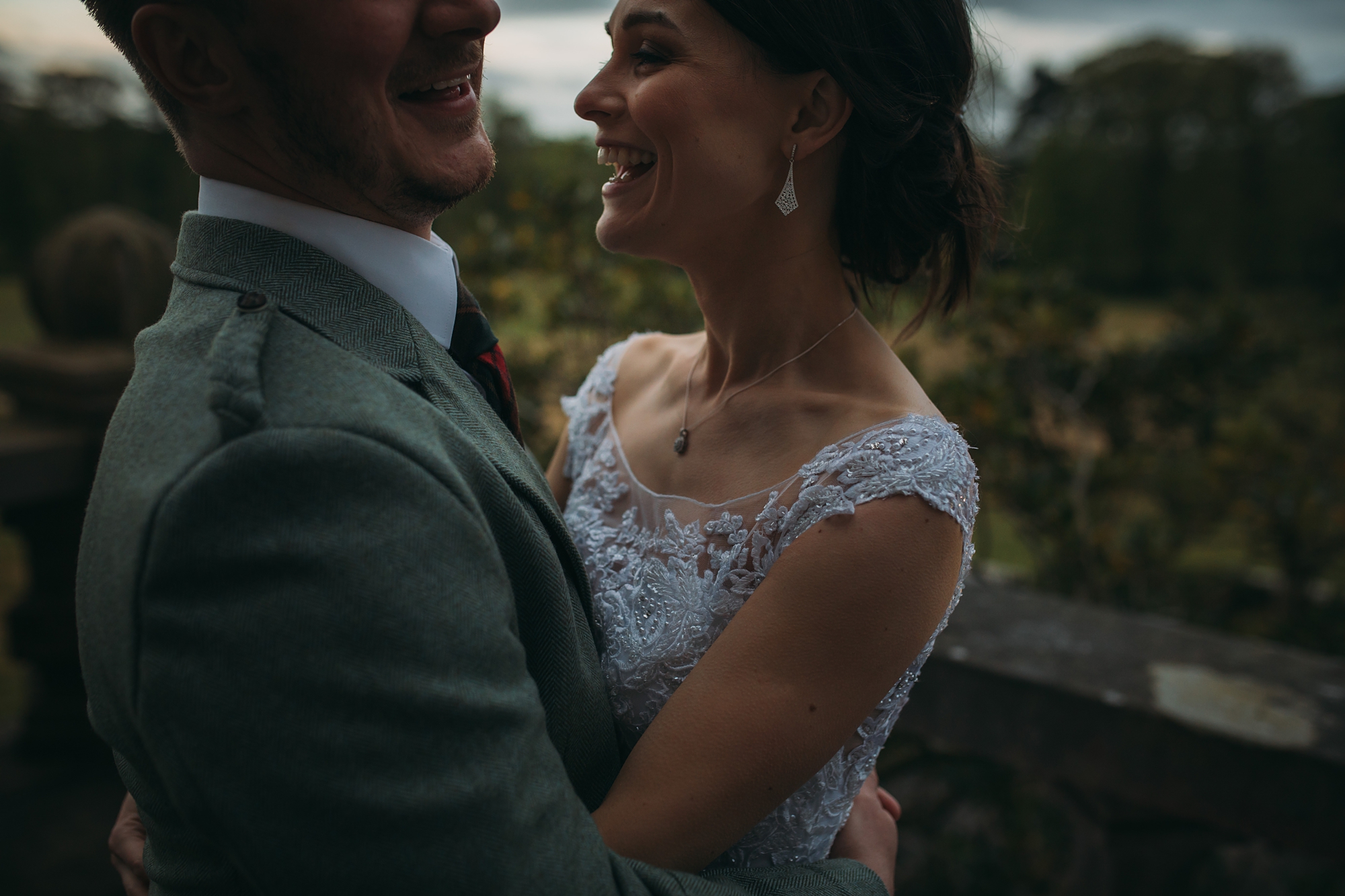 a couple embrace at rowallan castle during their best wedding photographs