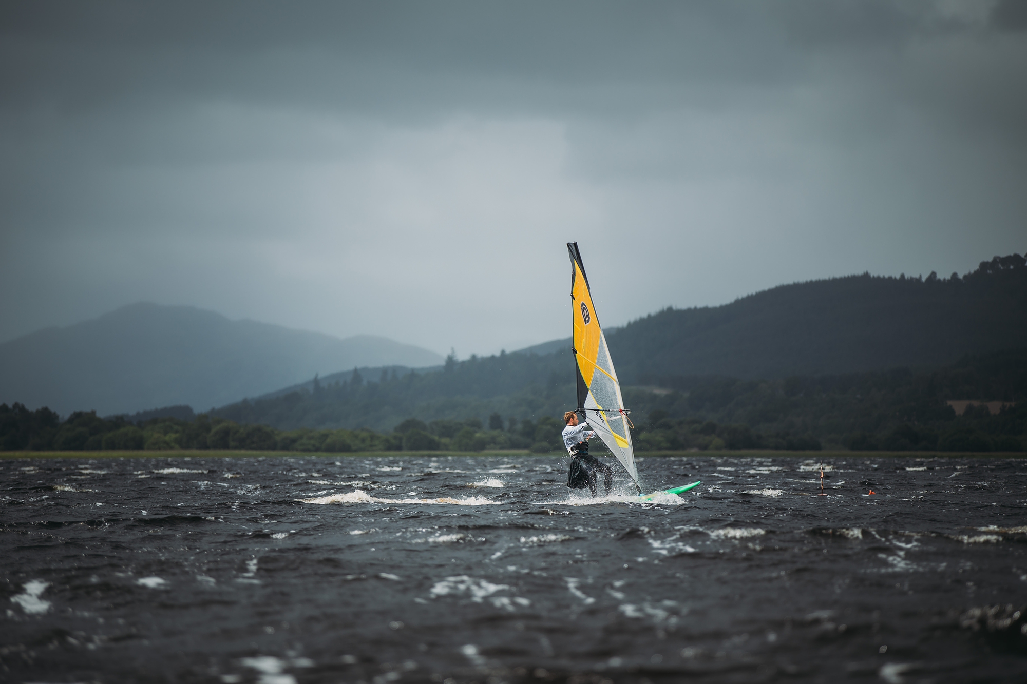 Groom windsurfs in kilt - best wedding photographs