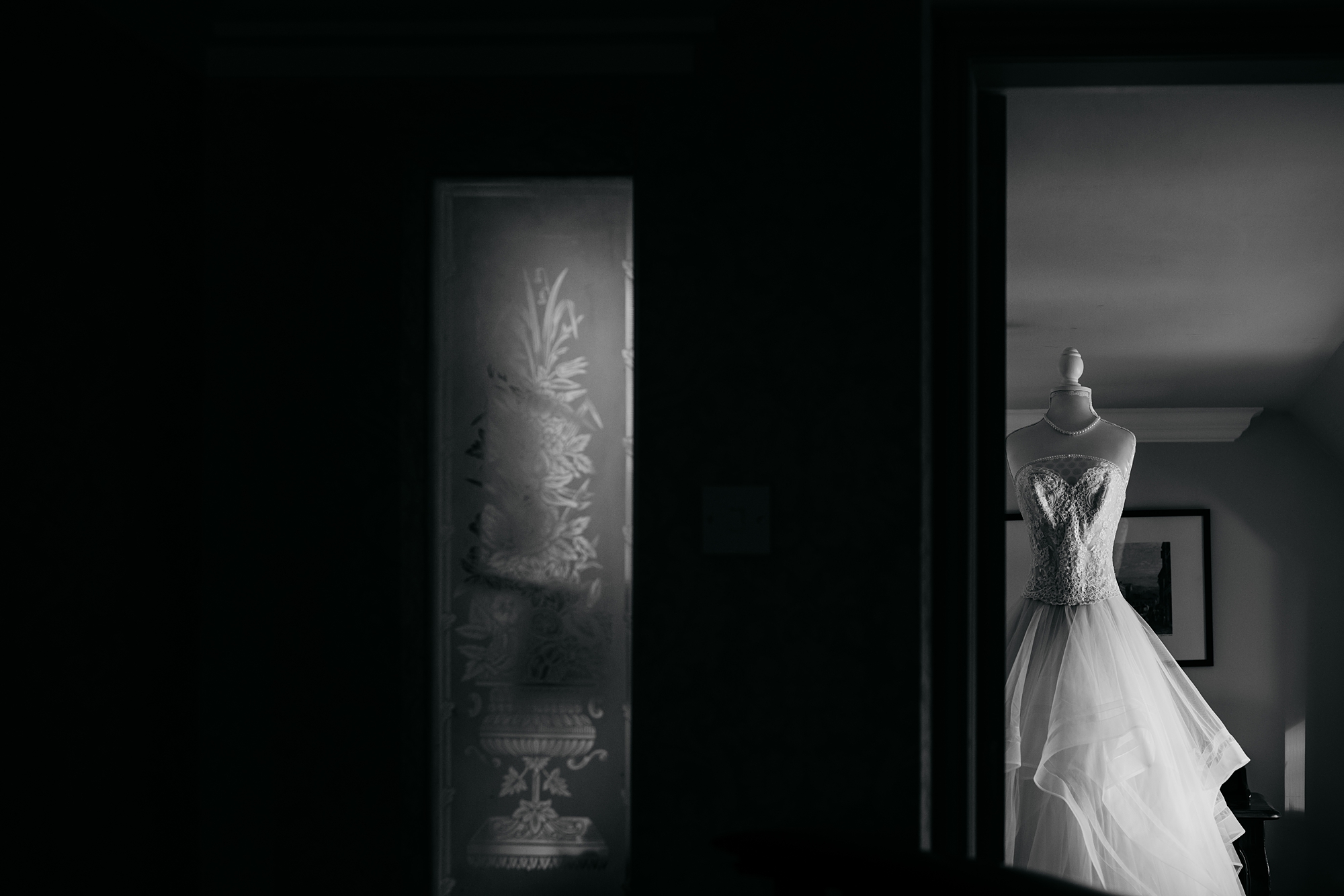 The brides dress on a dummy, waiting to be put on - best wedding photographs