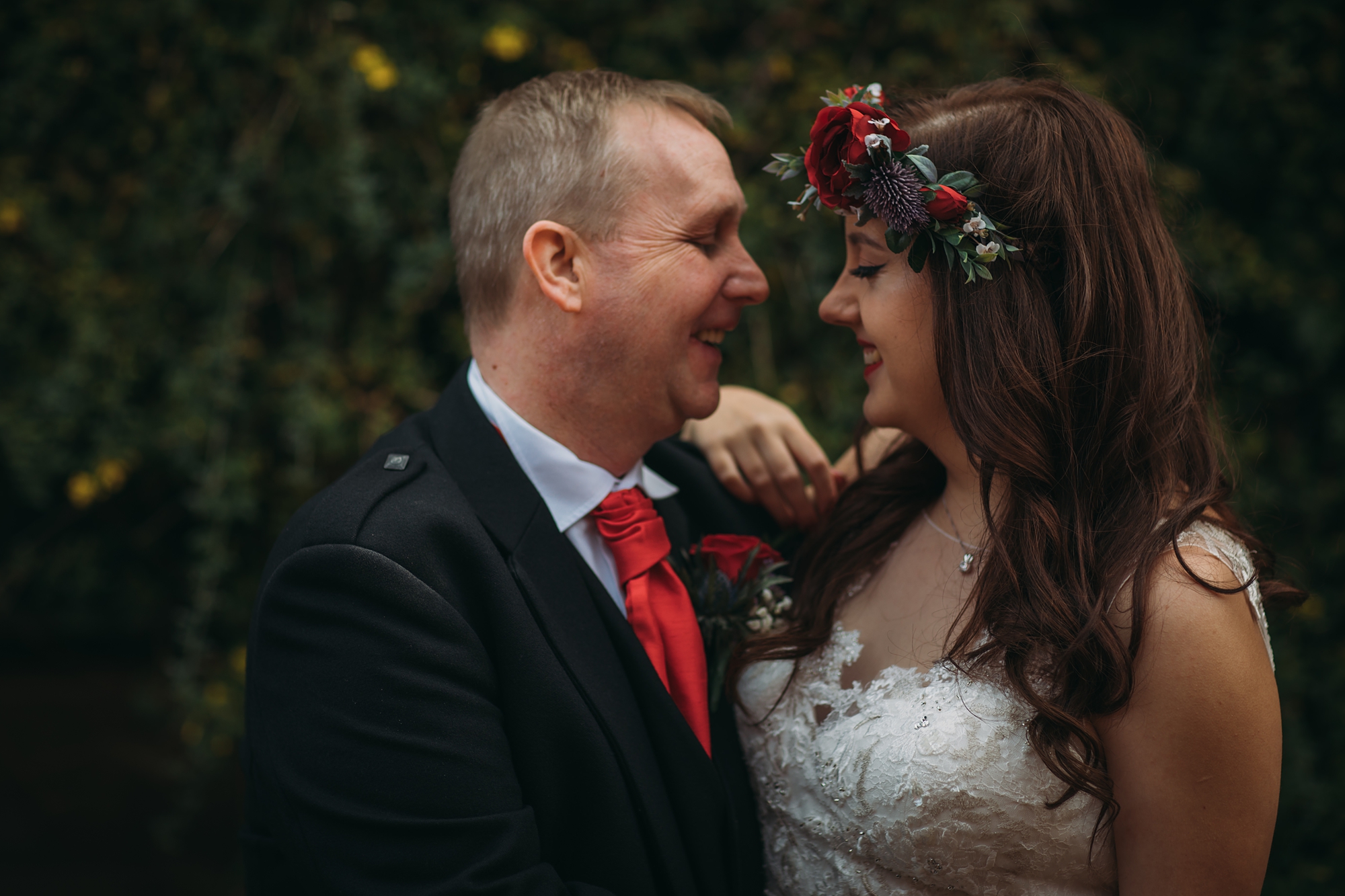 A couple during their Scottish elopement laugh together, best wedding photographs
