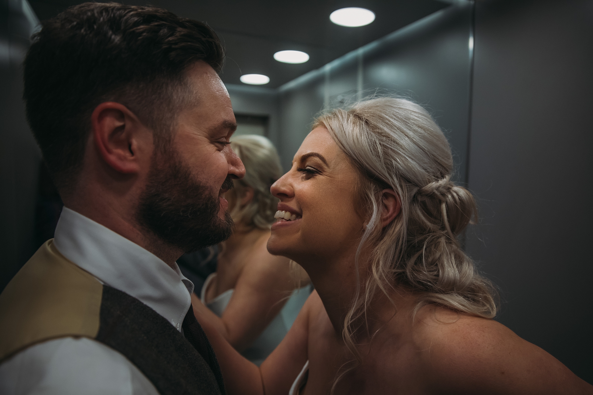 Newlyweds embrace in lift at Ghillie Dhu, best wedding photographs