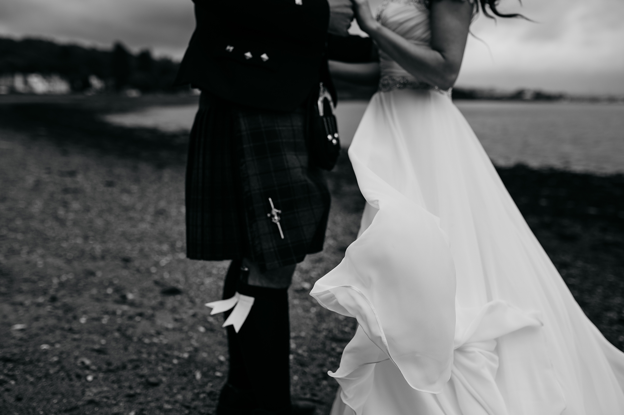 best wedding photographs of newlyweds on beach in Rhu, dress blowing wildly