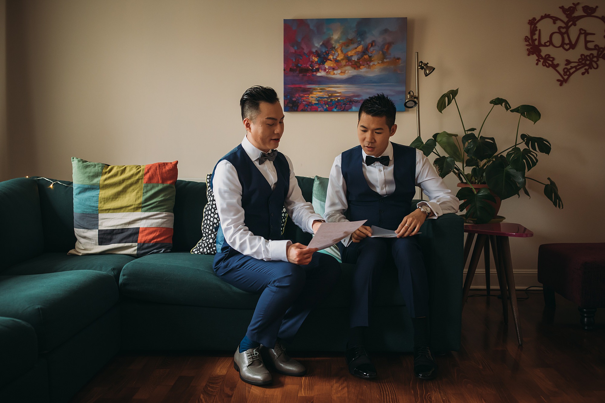 Two grooms go over their marriage ceremony ahead of their Glasgow elopement.