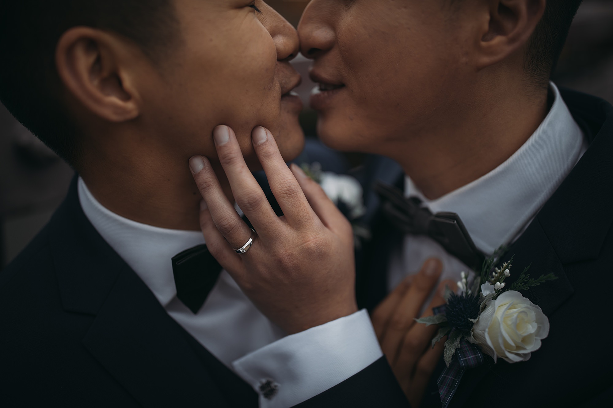 Two grooms kiss during their Glasgow elopement.