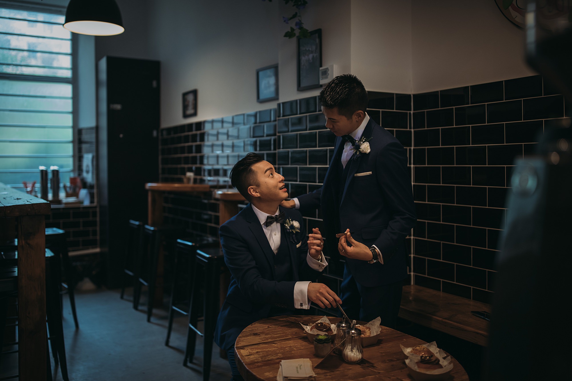 Two grooms make a stop at Tantrum Donuts during their Glasgow elopement.