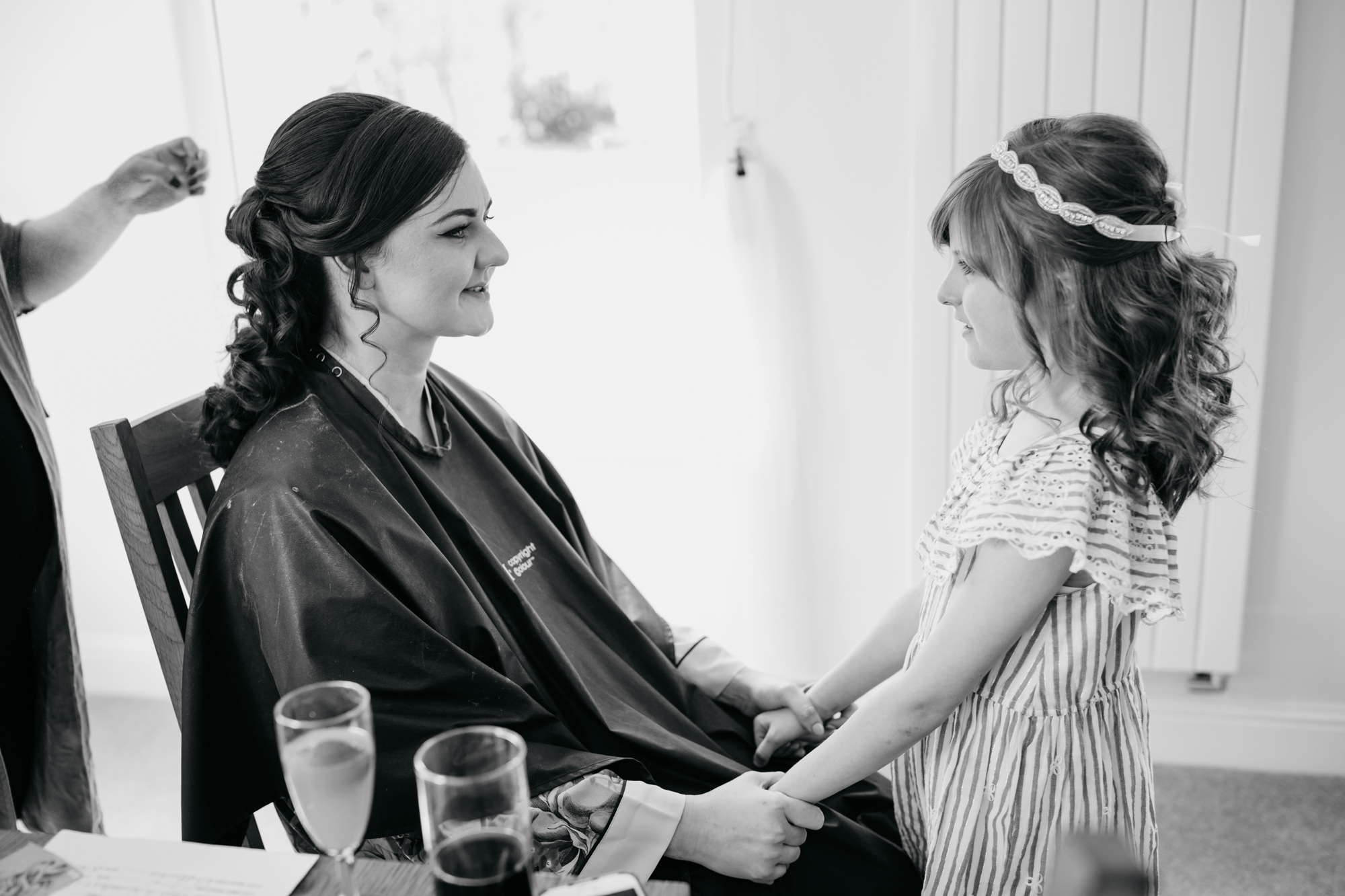 Bride speaks to little girl at her High Wards wedding