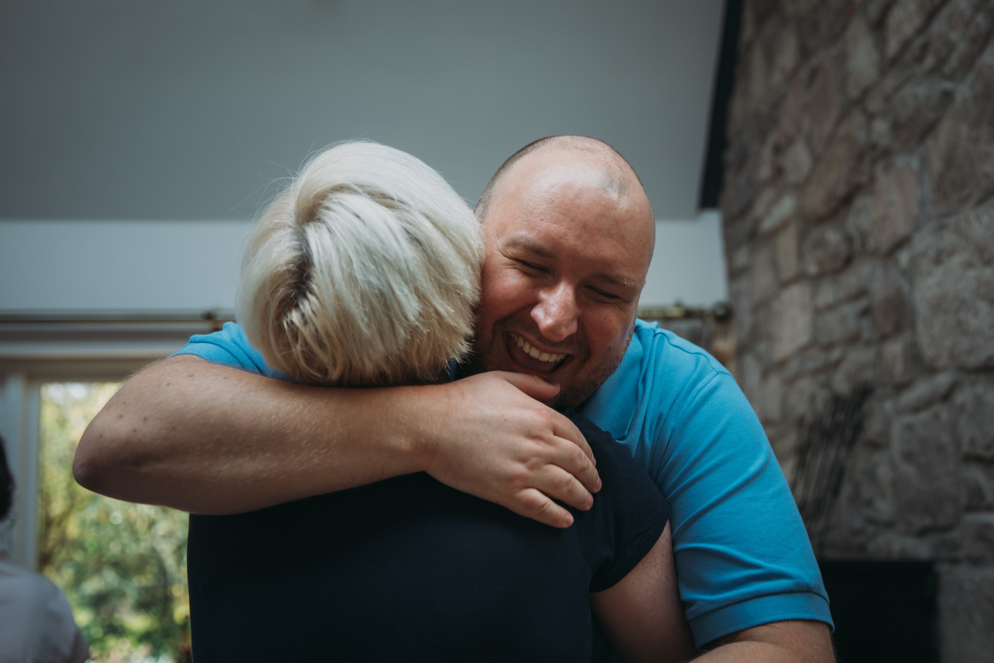 Groom greets Claire the Humanist with a huge hug at his High Wards wedding