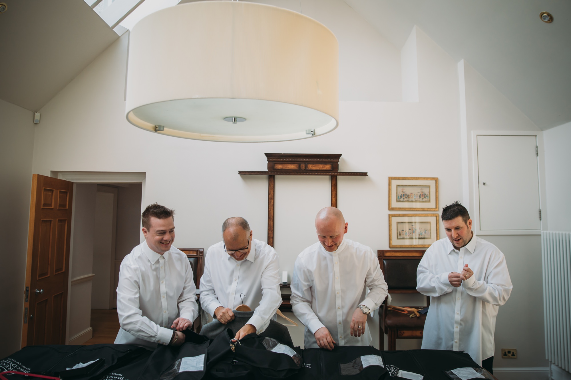 Groomsmen getting ready ahead of a High Wards wedding