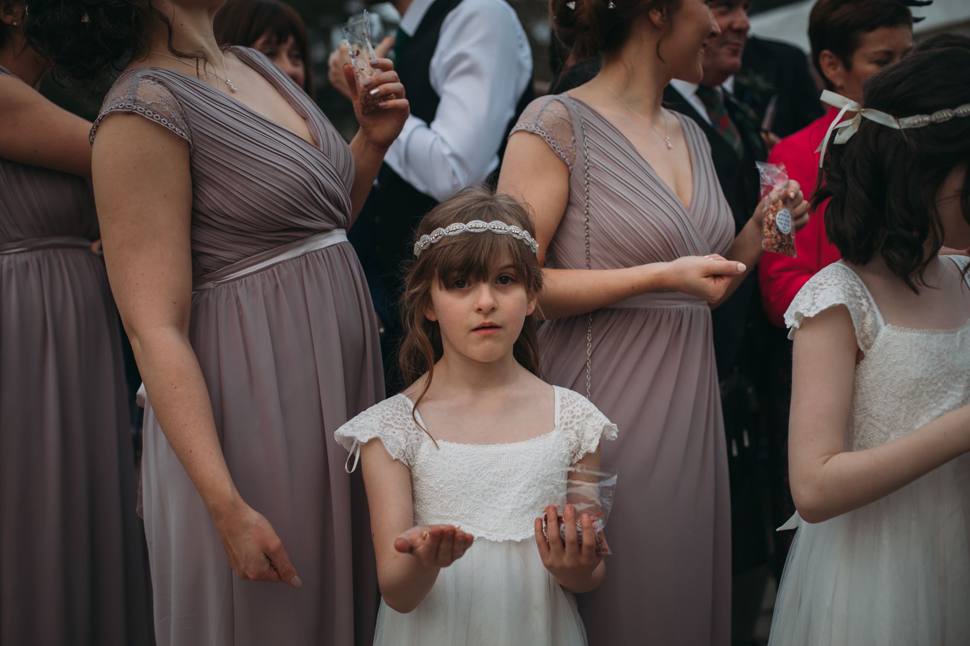 Flower girl patiently waits to throw confetti at a High Wards wedding