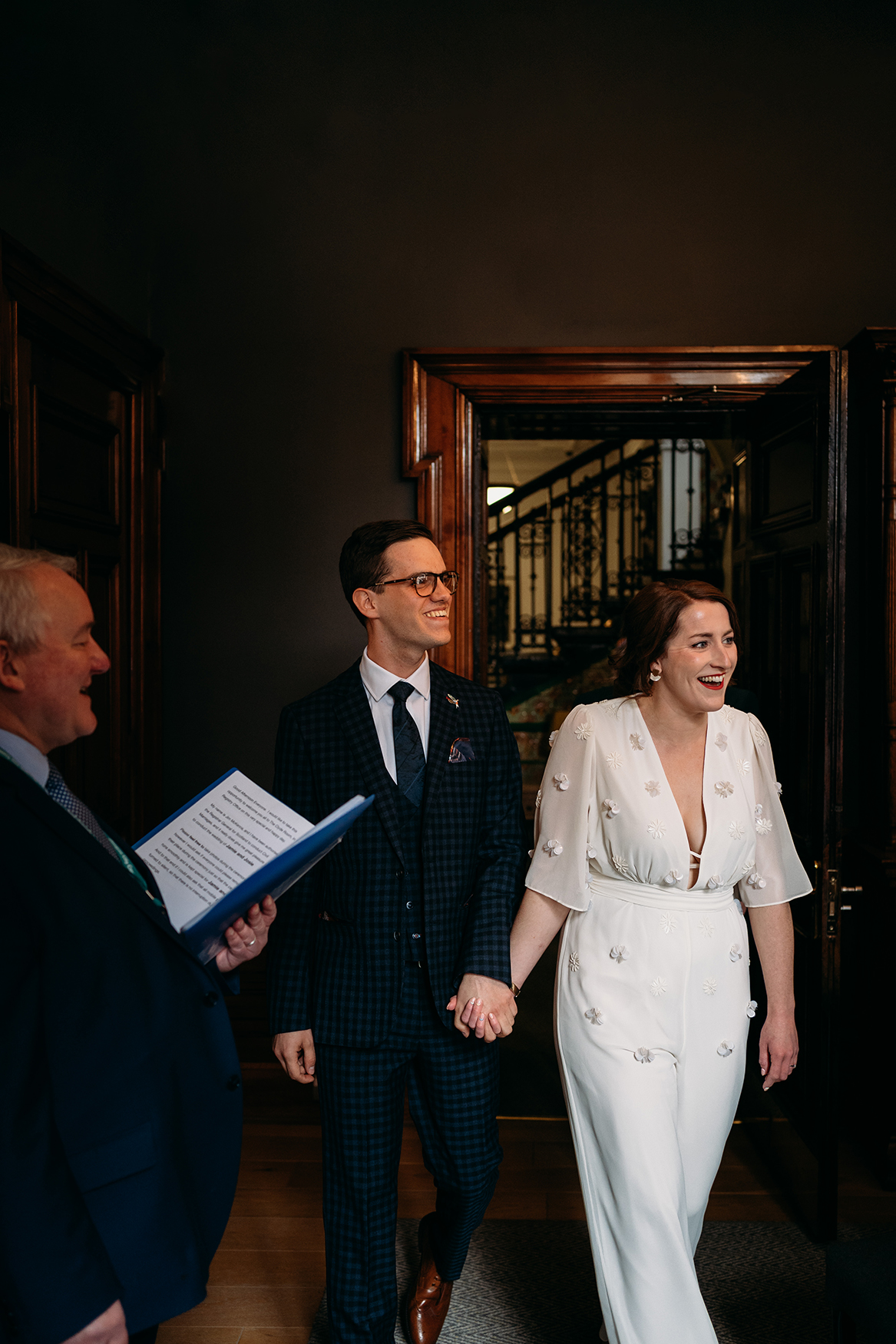 couple walk into Glasgow City Chambers Wedding