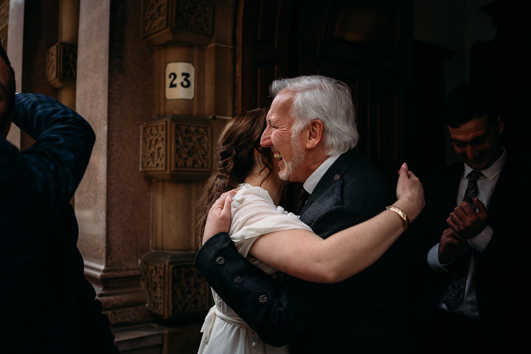 dad hugs bride at Glasgow City Chambers Wedding