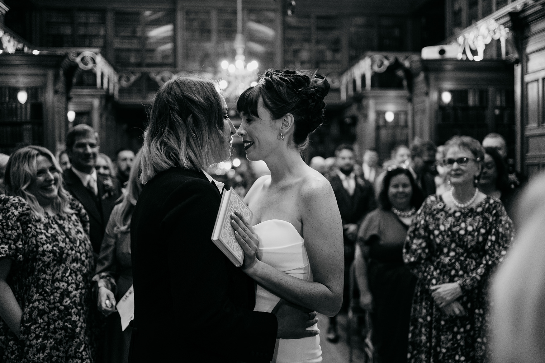 black and white image of lesbian couple embracing at their Royal College of Physicians Wedding ceremony