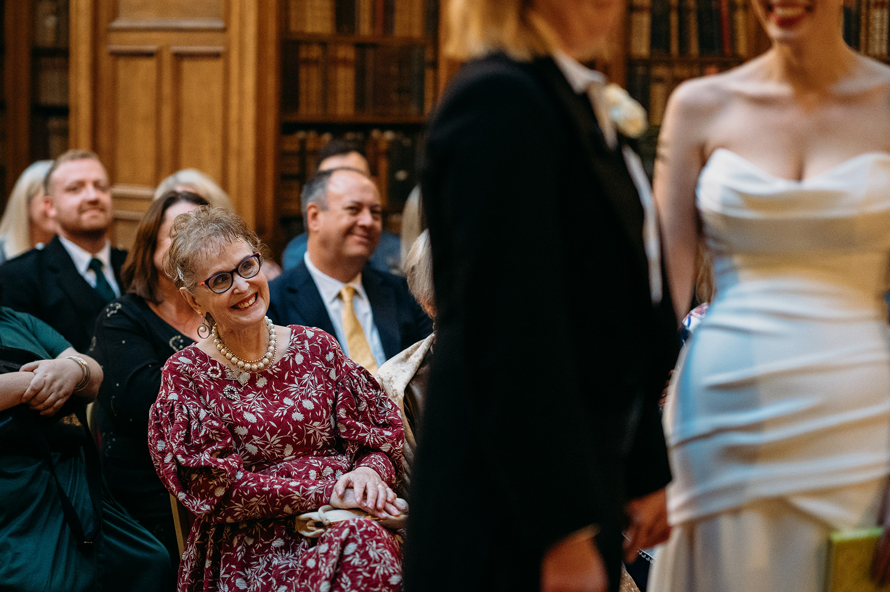 mother of bride looks at daughter with pride during her Royal College of Physicians Wedding ceremony