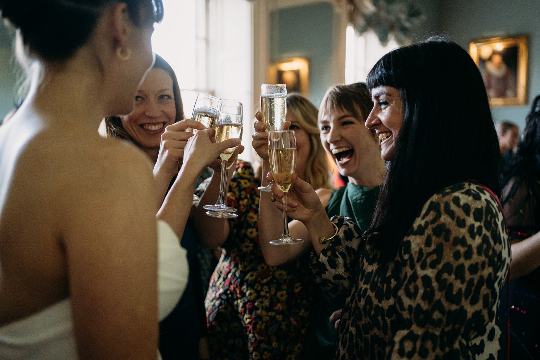 group cheers champagne glasses at Royal College of Physicians Wedding reception