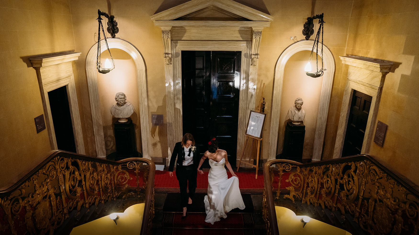 two brides on stair case at Royal College of Physicians Wedding