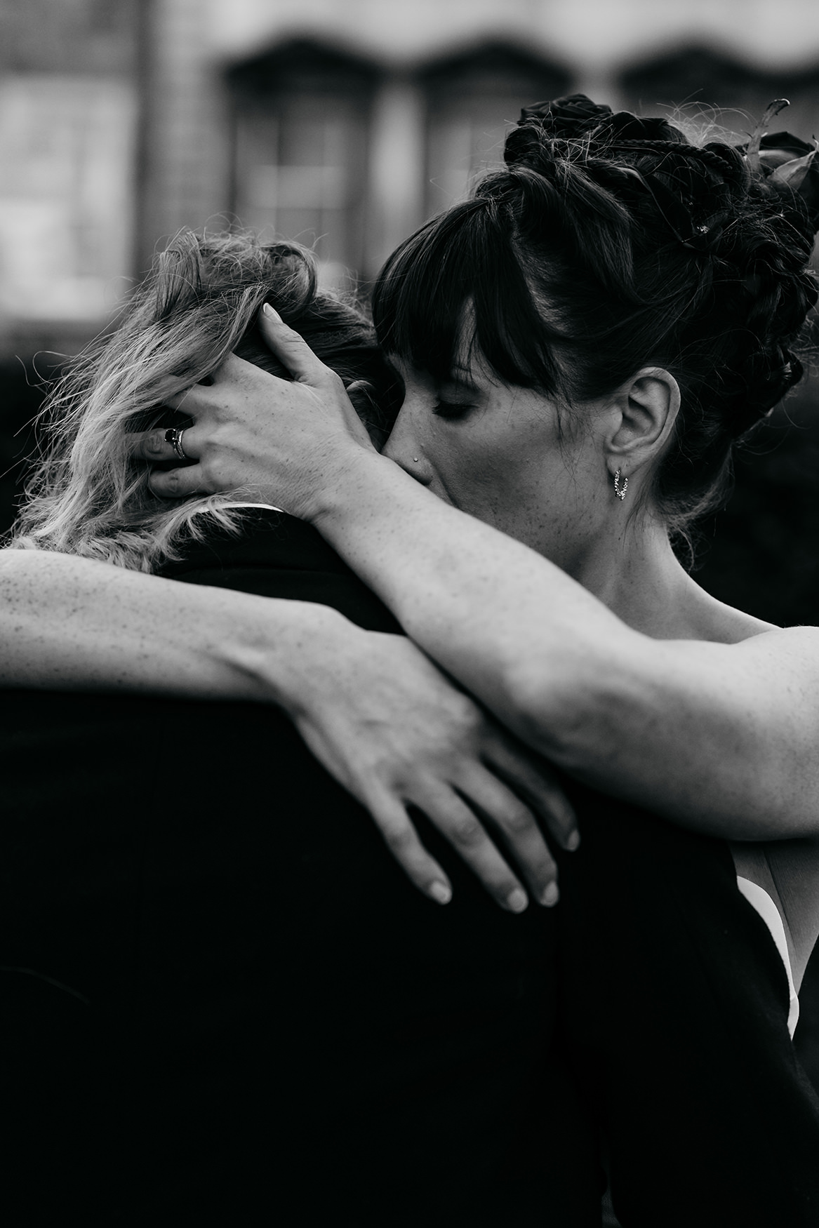 black and white photograph of two brides embracing at Royal College of Physicians Wedding Edinburgh