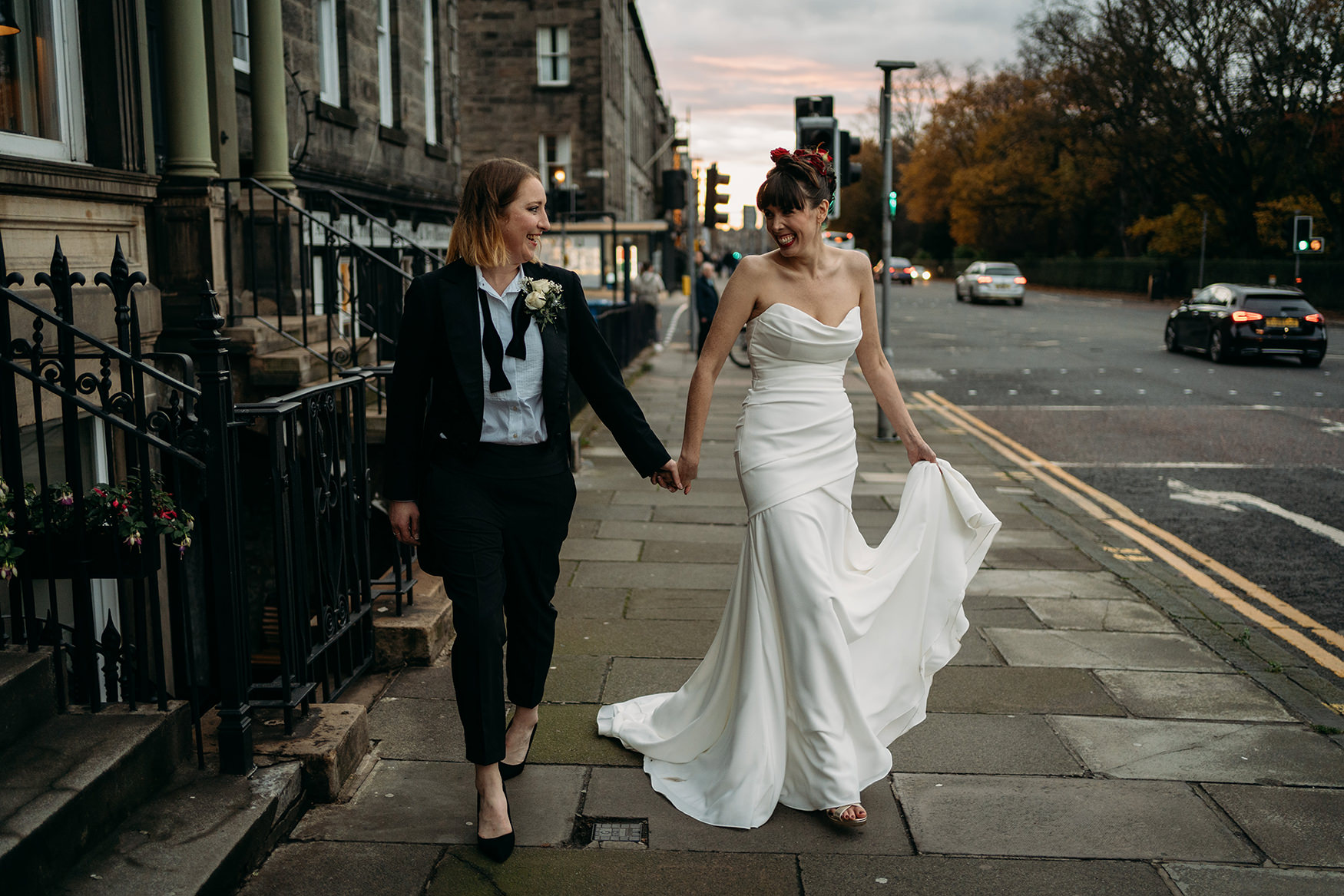 two brides walking through Edinburgh at their Royal College of Physicians Wedding