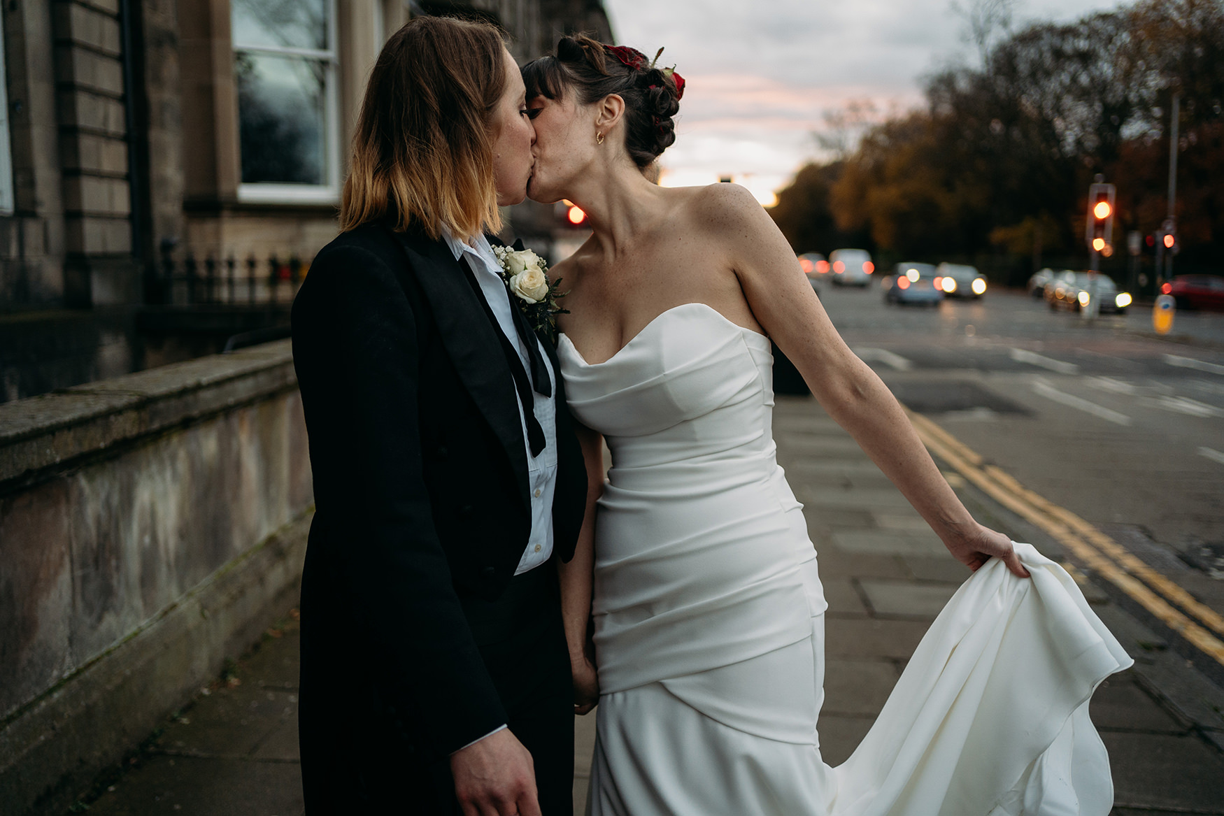 two brides kiss for a blog about making sure to back up your wedding photographs