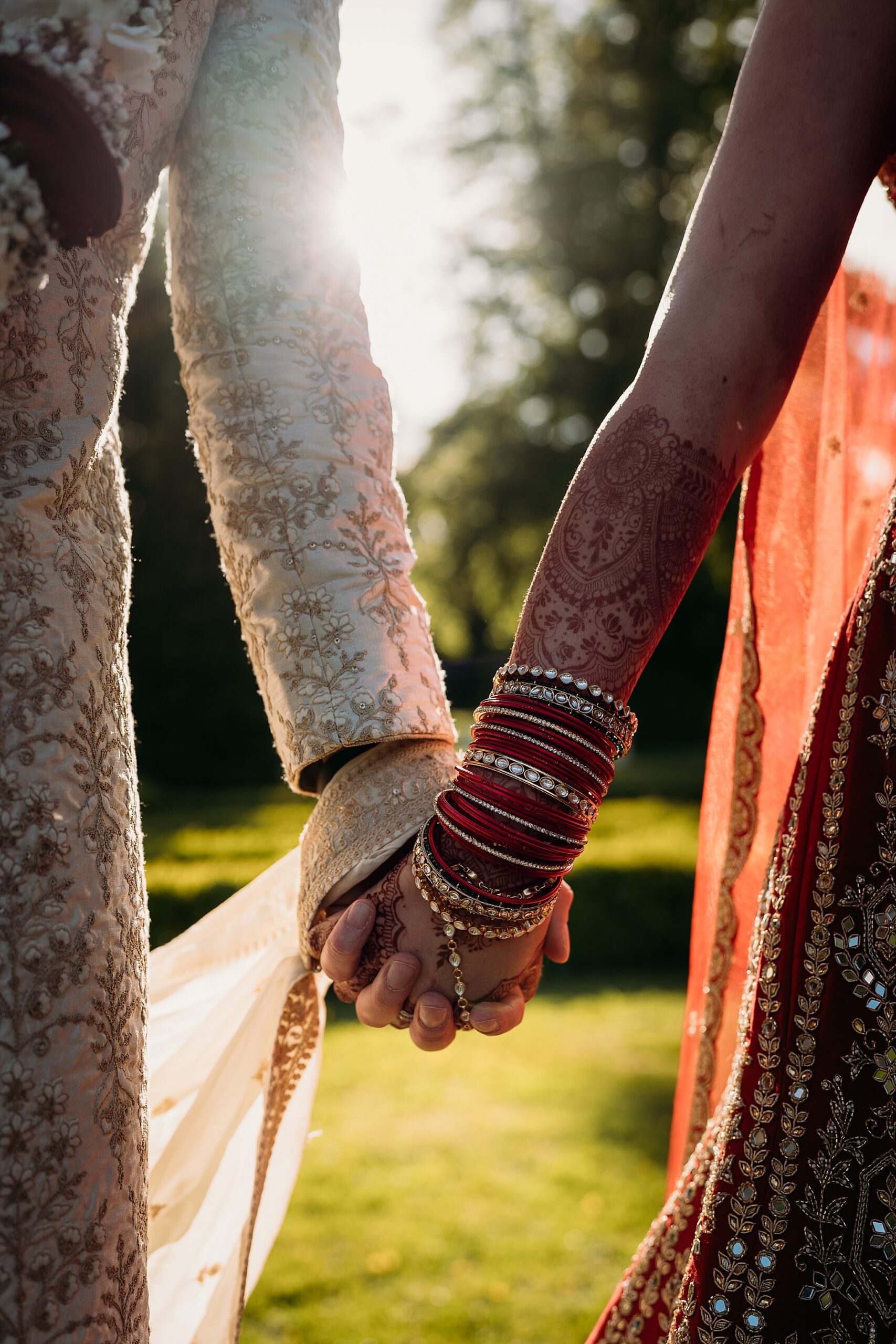 Closeup of Newlyweds holding hands during Indo-Scottish Achnagairn Castle wedding