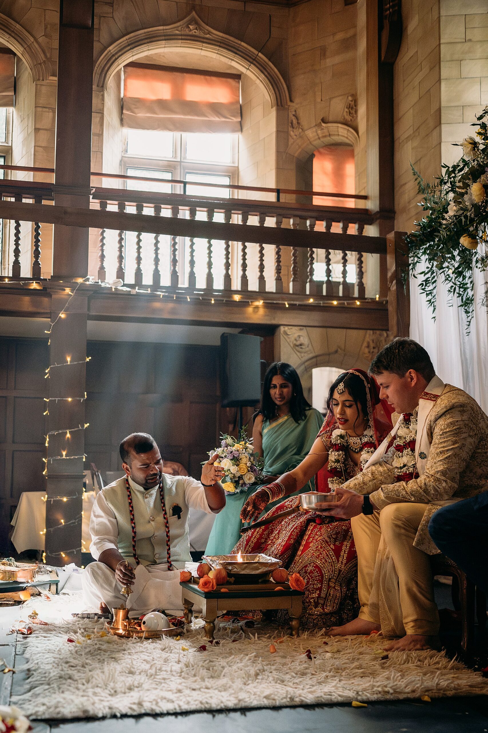 Smoke caught in window light during Indo-Scottish Achnagairn Castle wedding ceremony