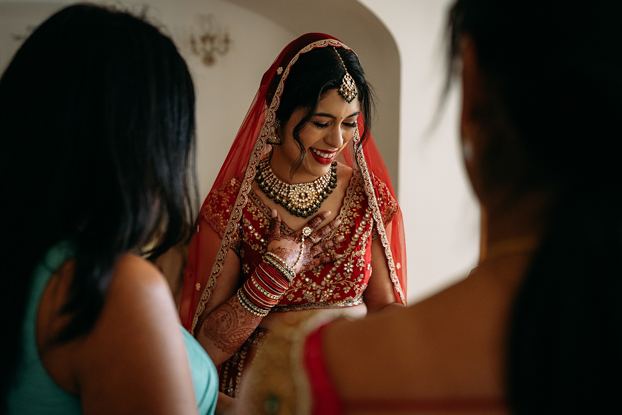 Bride shares a touching moment with her best friends before her Indo-Scottish Achnagairn Castle wedding