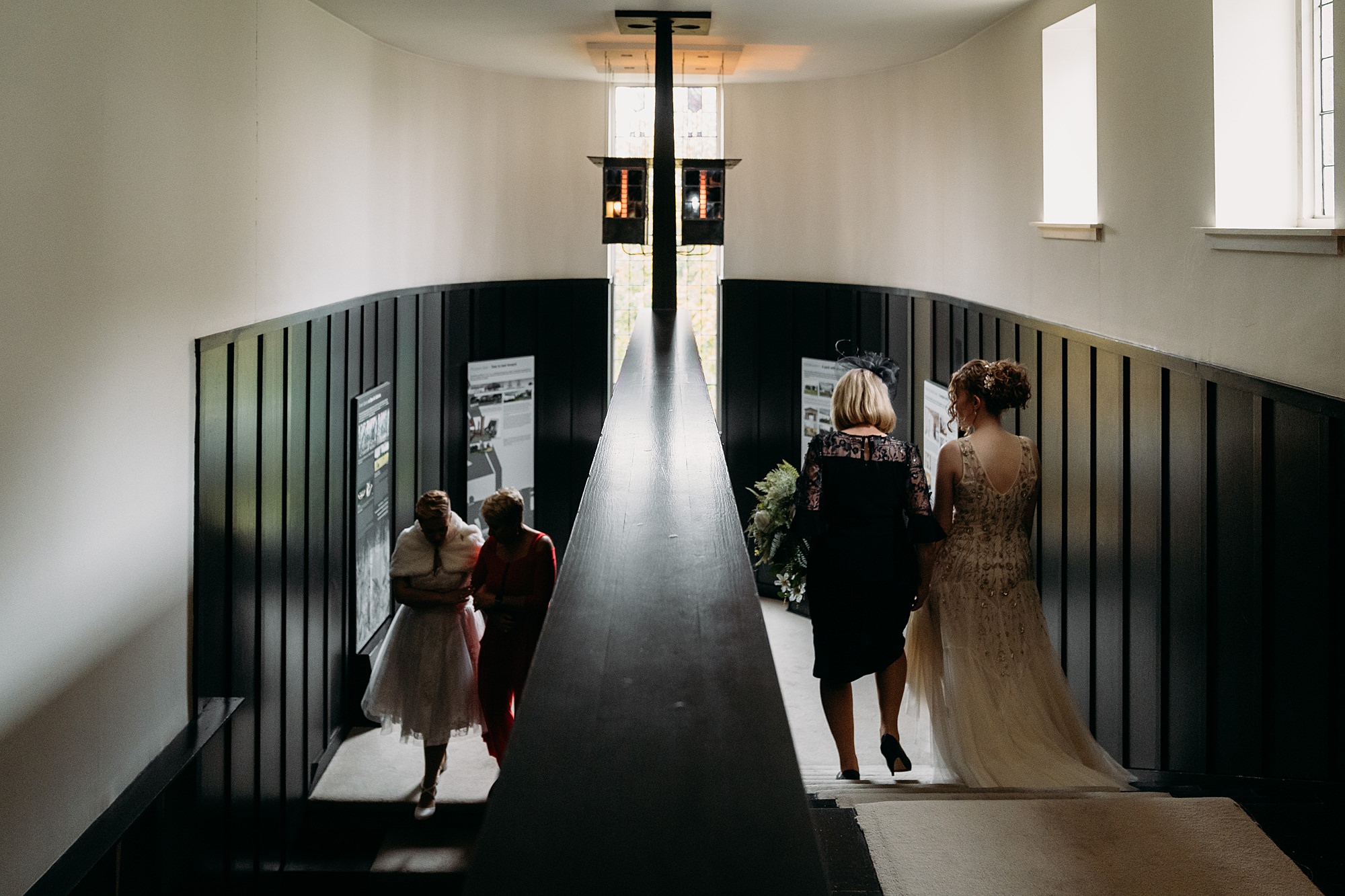 Two brides walked to their ceremony by their mums. Relaxed wedding photography at House for an Art Lover Glasgow.