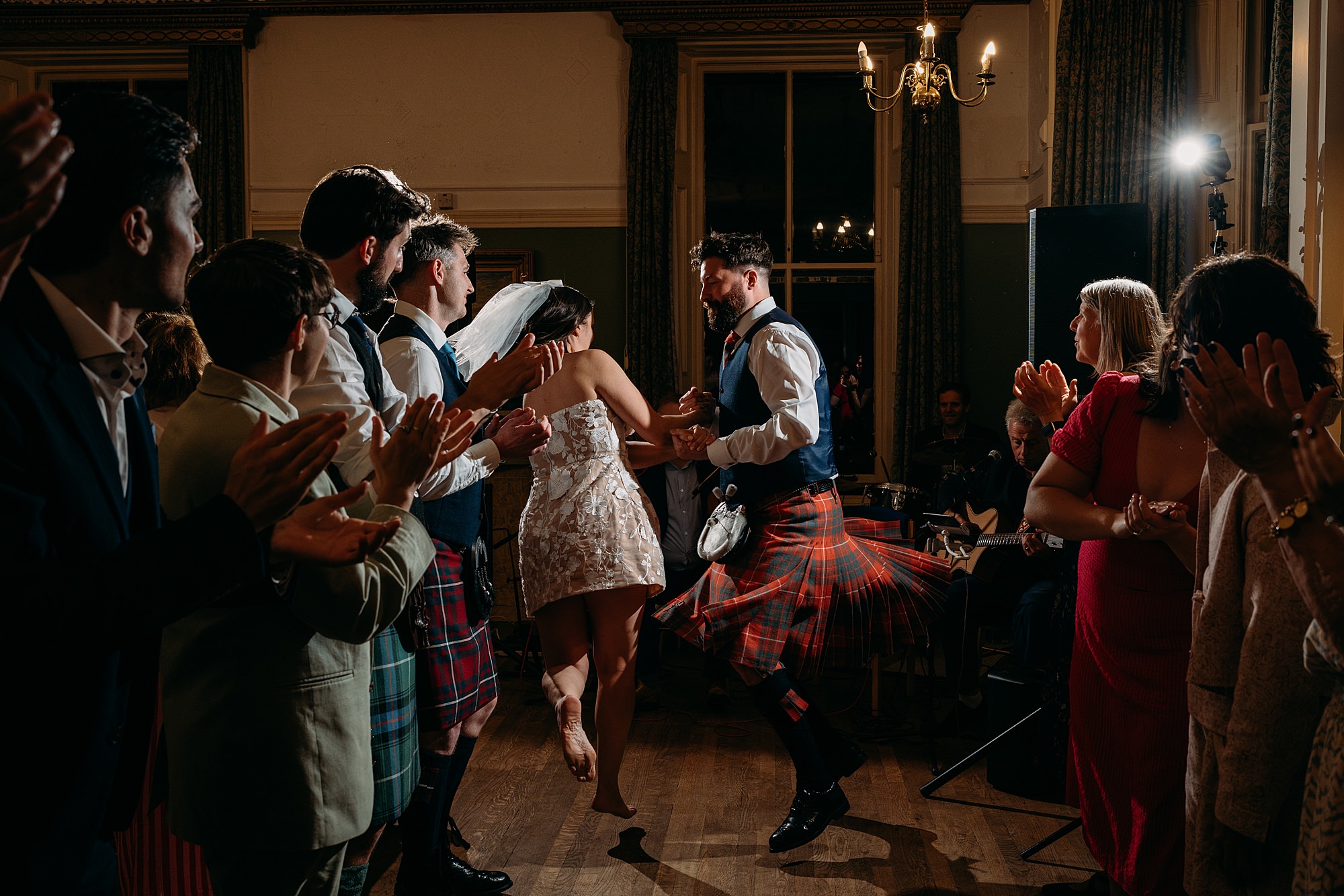 Couple do a ceilidh as their first dance in Helensburgh. Relaxed wedding photography